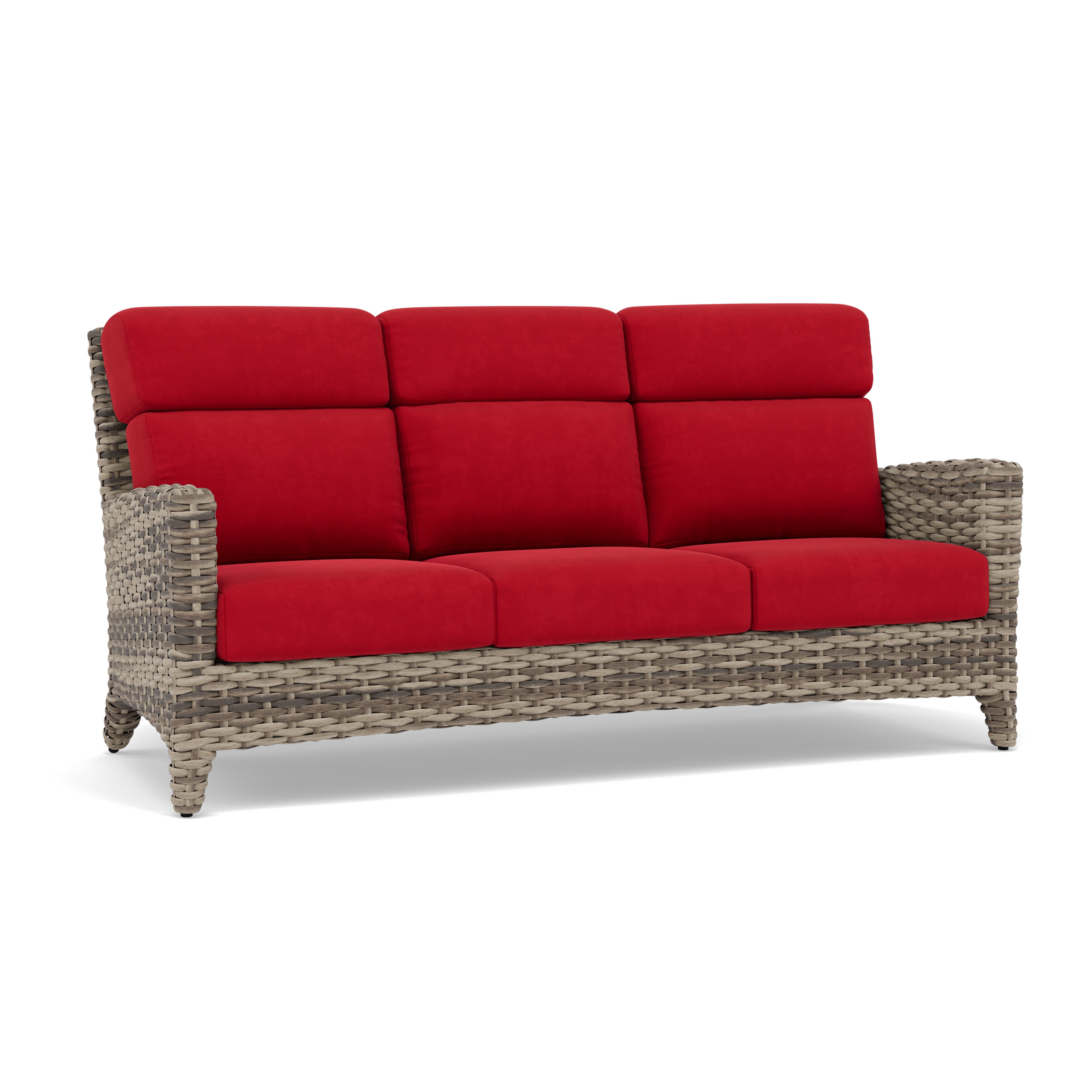 Wicker outdoor sofa with red cushions.