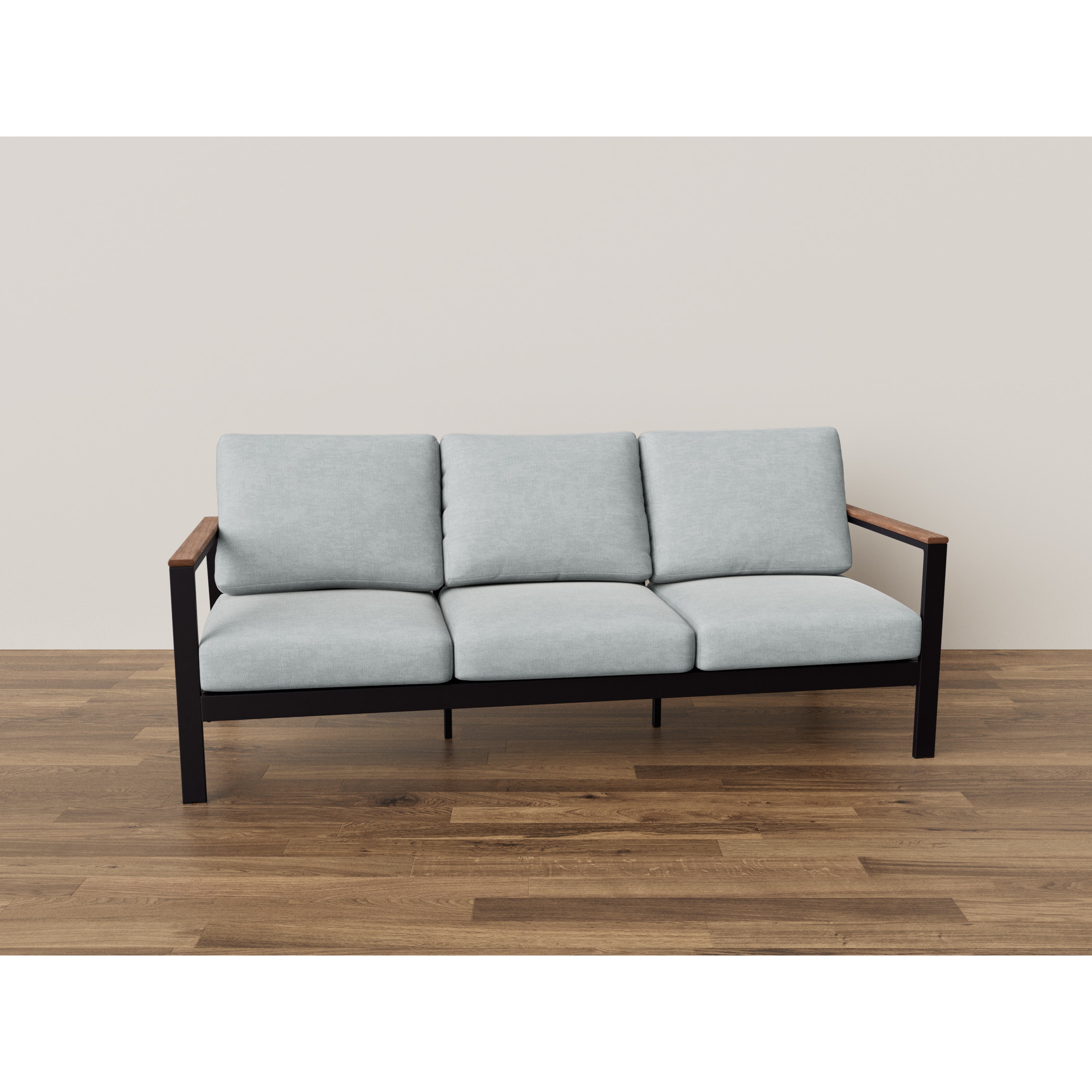 Modern three-seat sofa with light gray cushions and wooden arms on a hardwood floor.