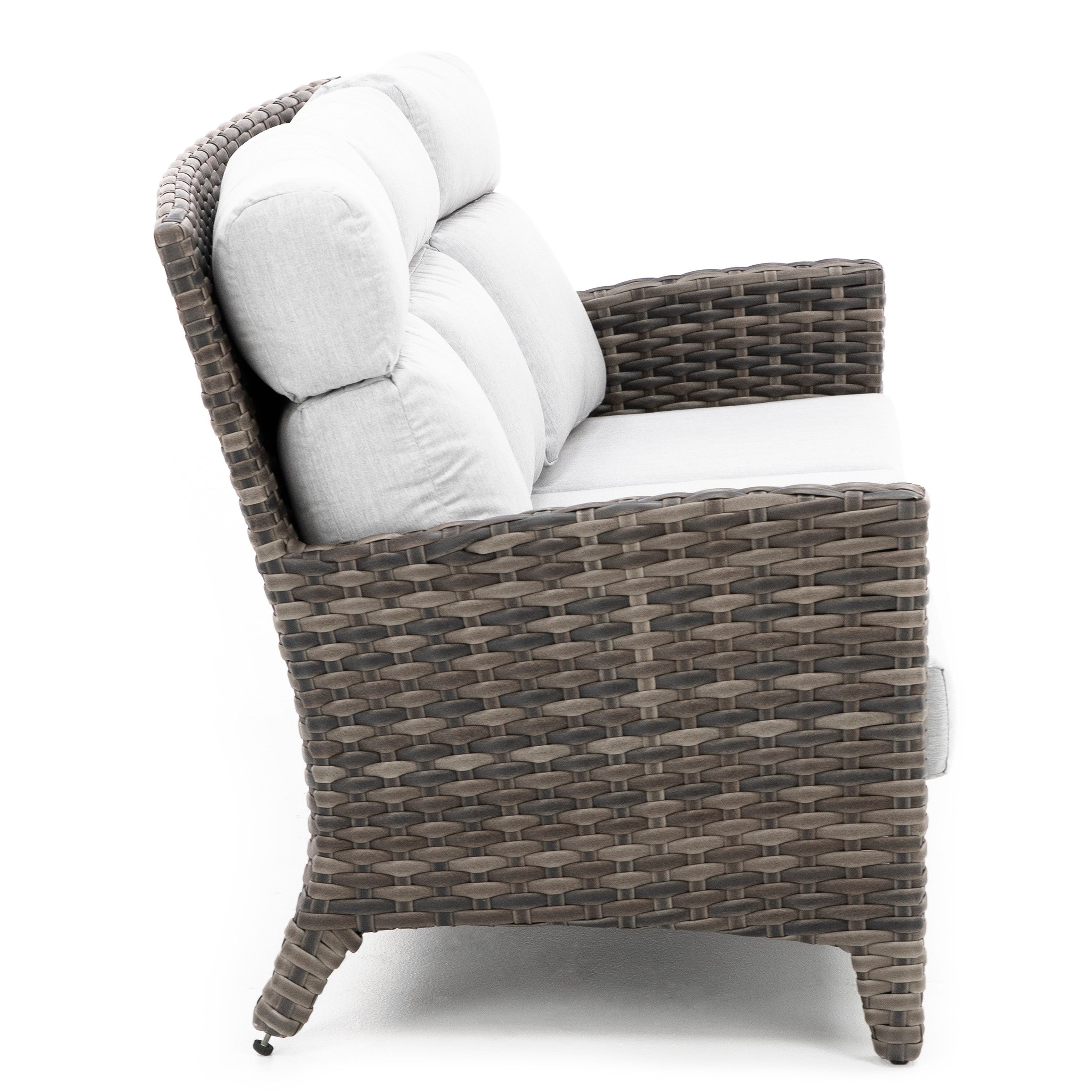 Side view of a wicker loveseat with light gray cushions.