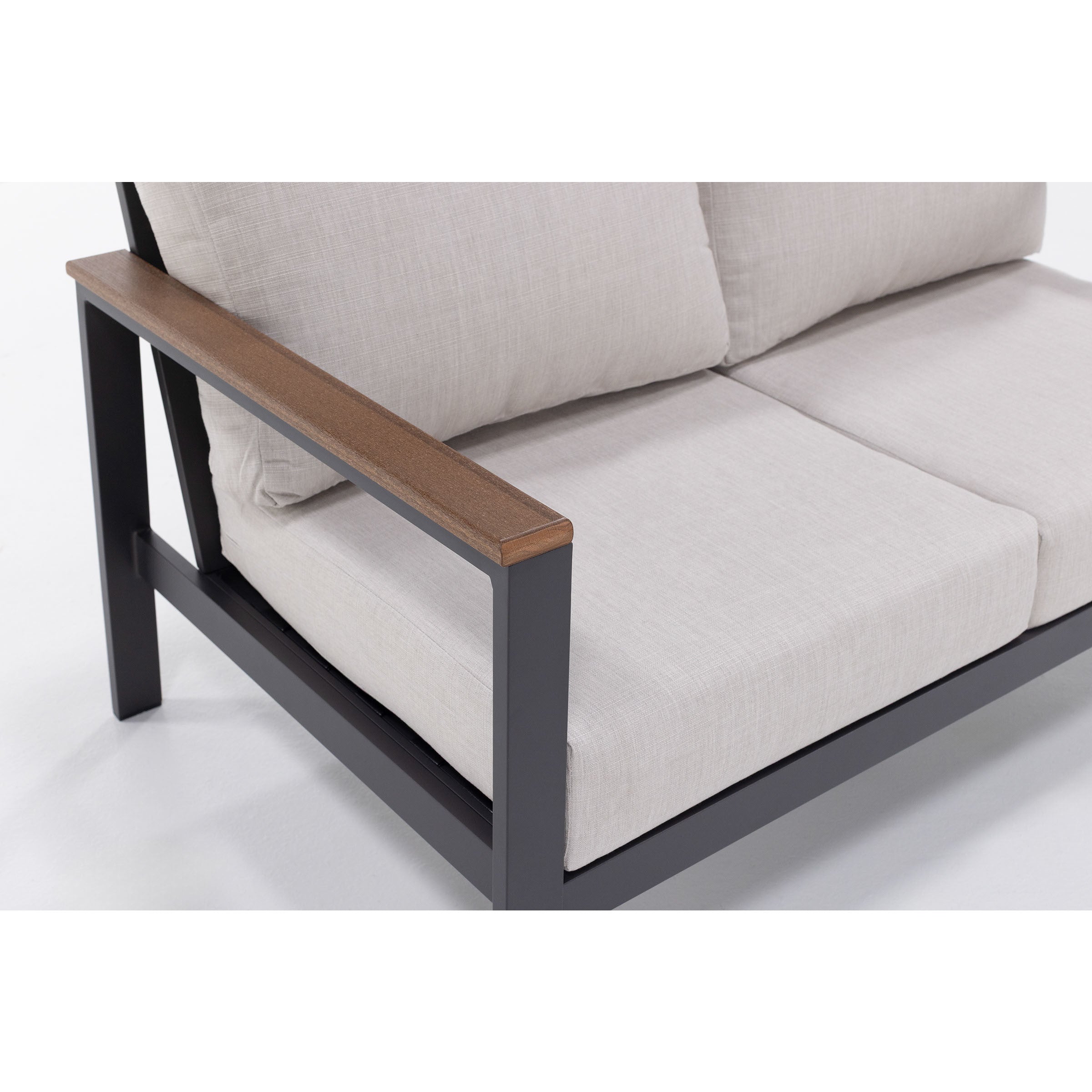 Close-up of a modern outdoor sofa with beige cushions and wood armrest.