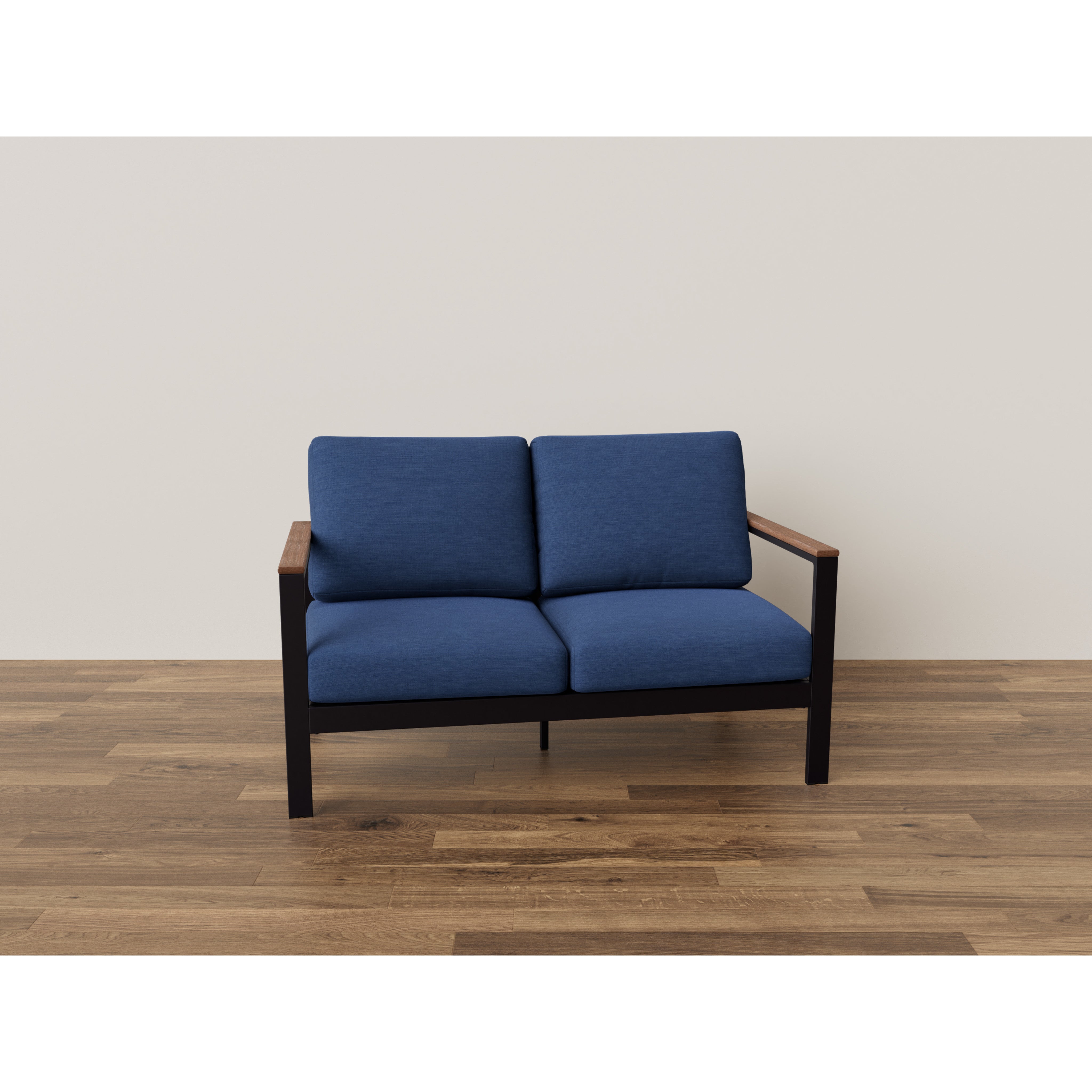 Blue cushioned loveseat with wooden arms on hardwood floor.