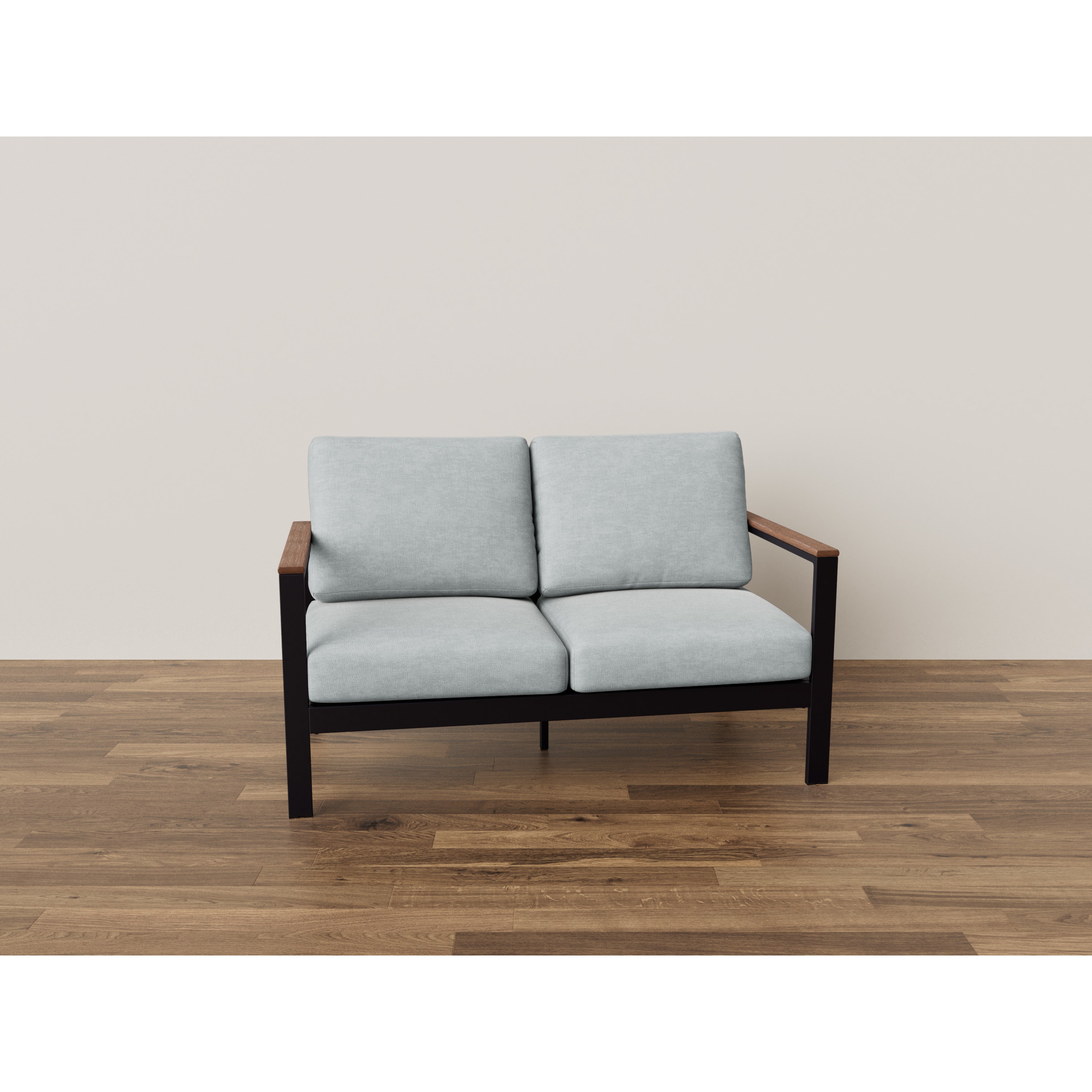 Modern two-seat sofa with light gray cushions and wooden arms on a wood floor.