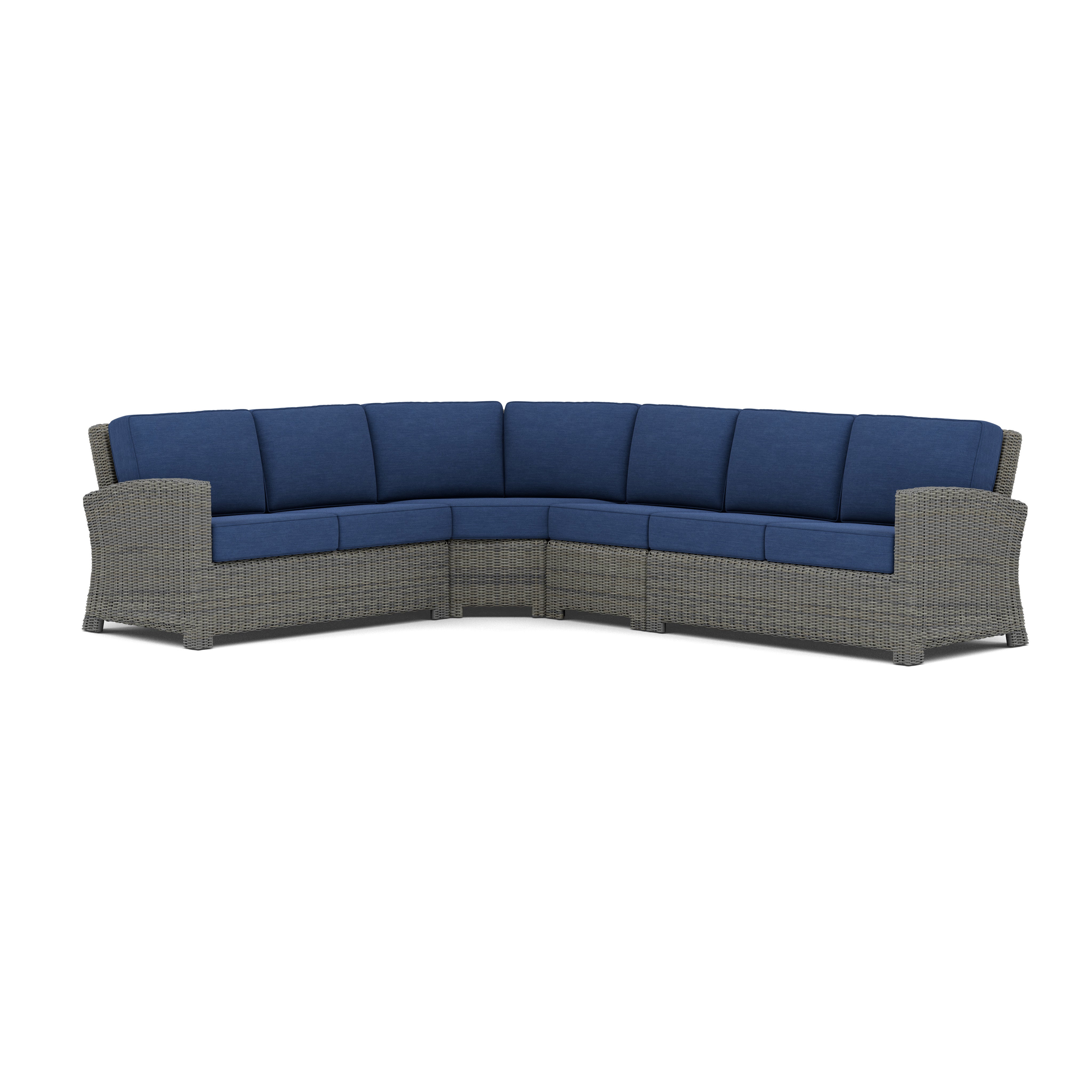 Gray wicker outdoor corner sectional sofa with blue cushions.