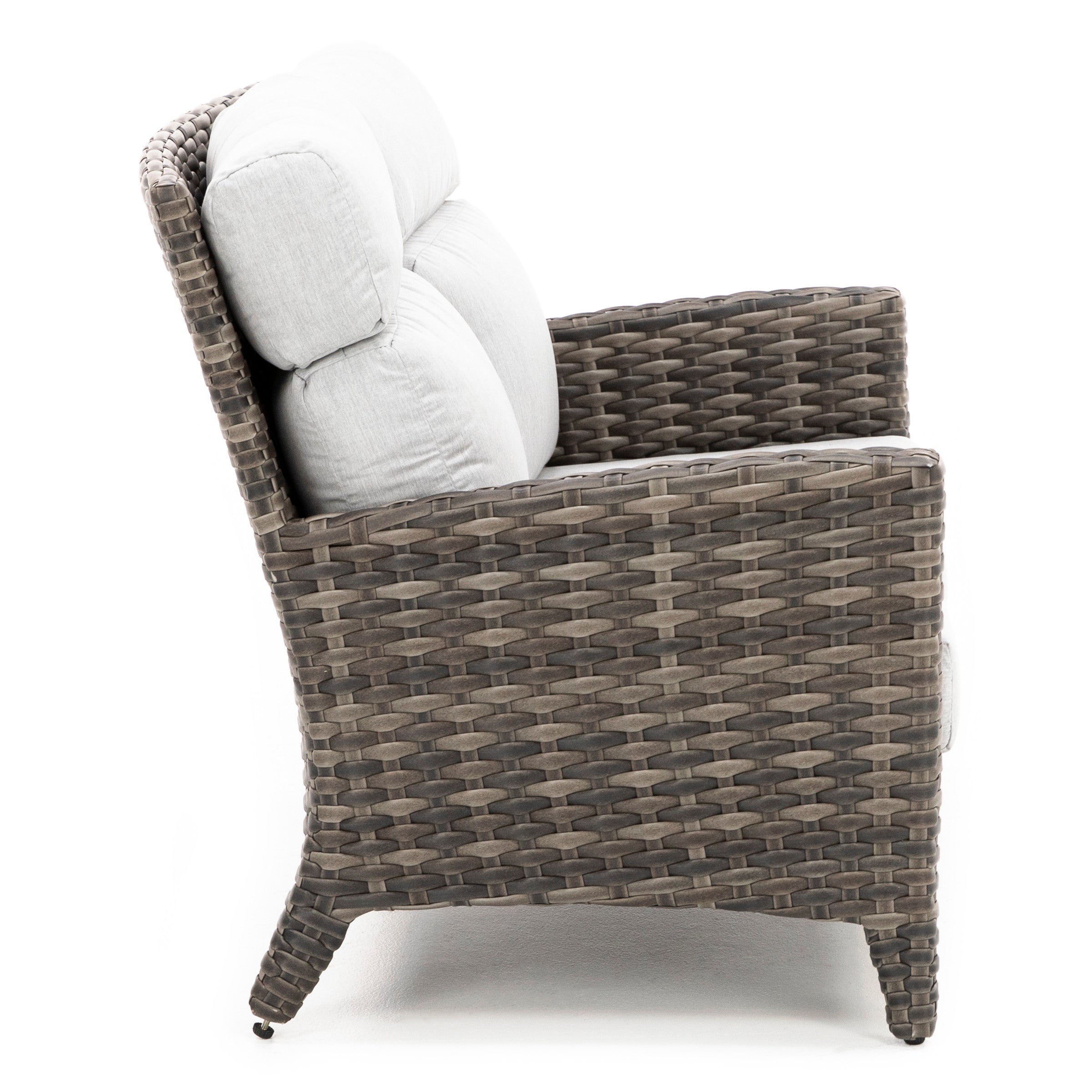 Side view of a woven outdoor armchair with light gray cushions.