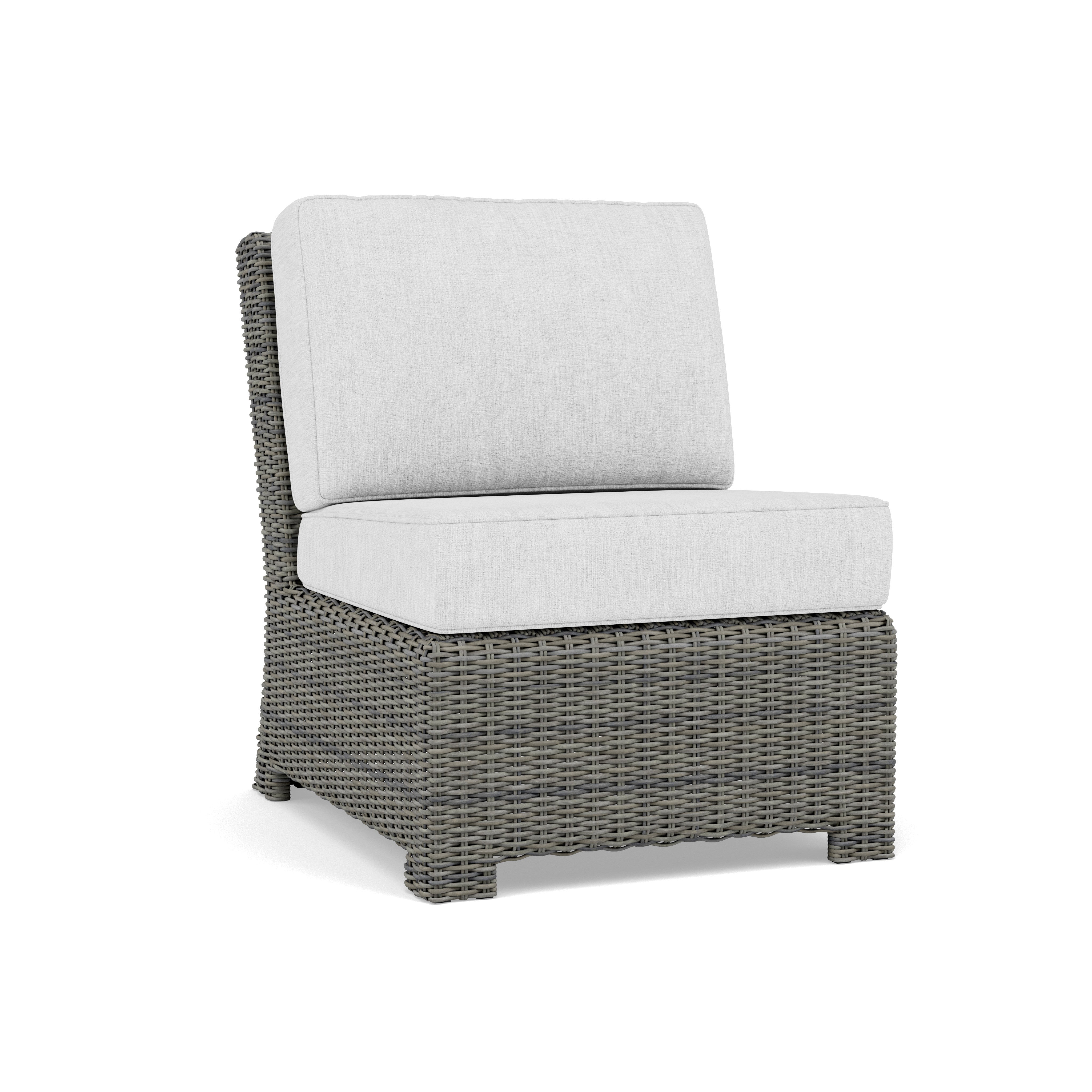 Gray wicker armless outdoor chair with light gray cushions.