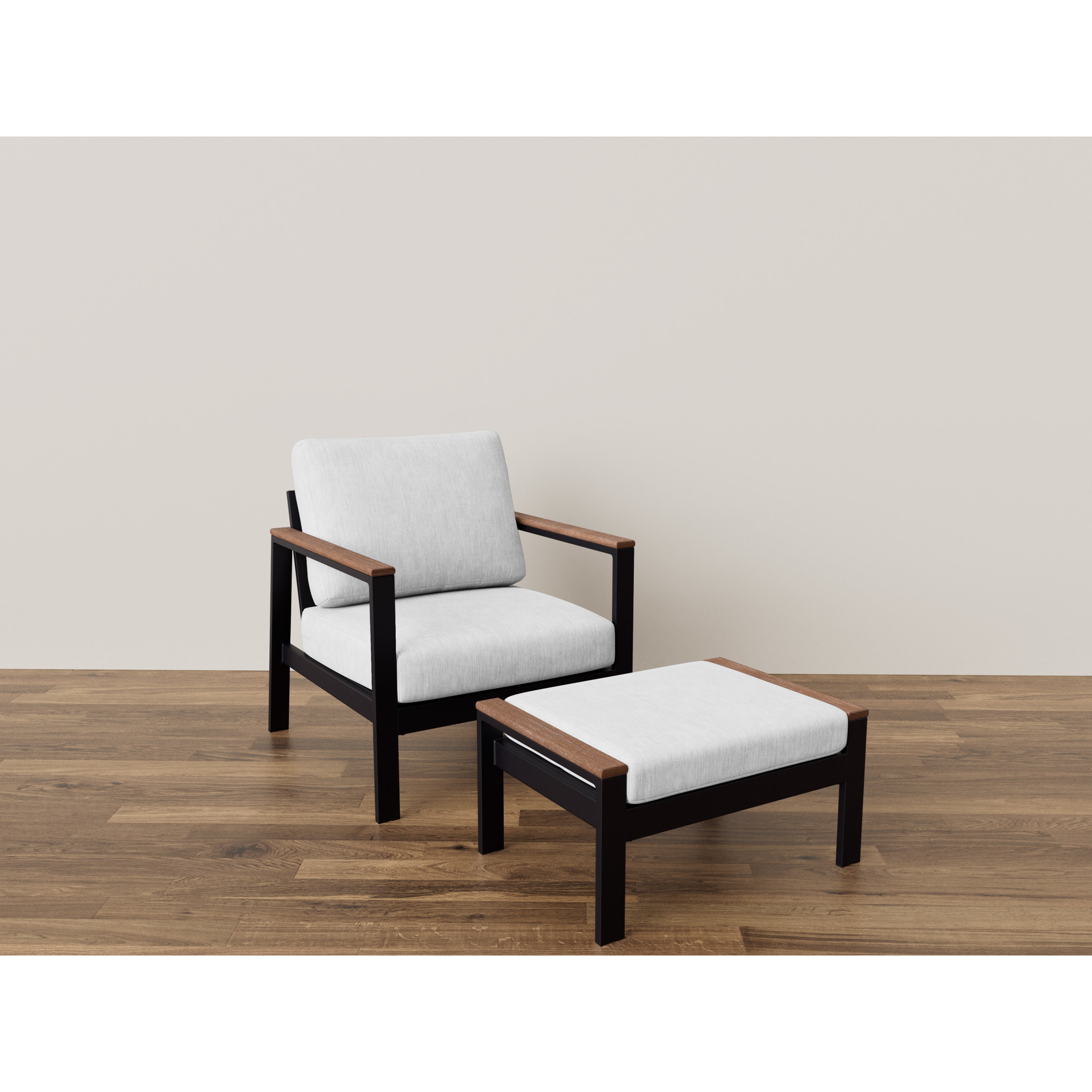 Modern lounge chair with ottoman, black frame and light cushions on wood floor.