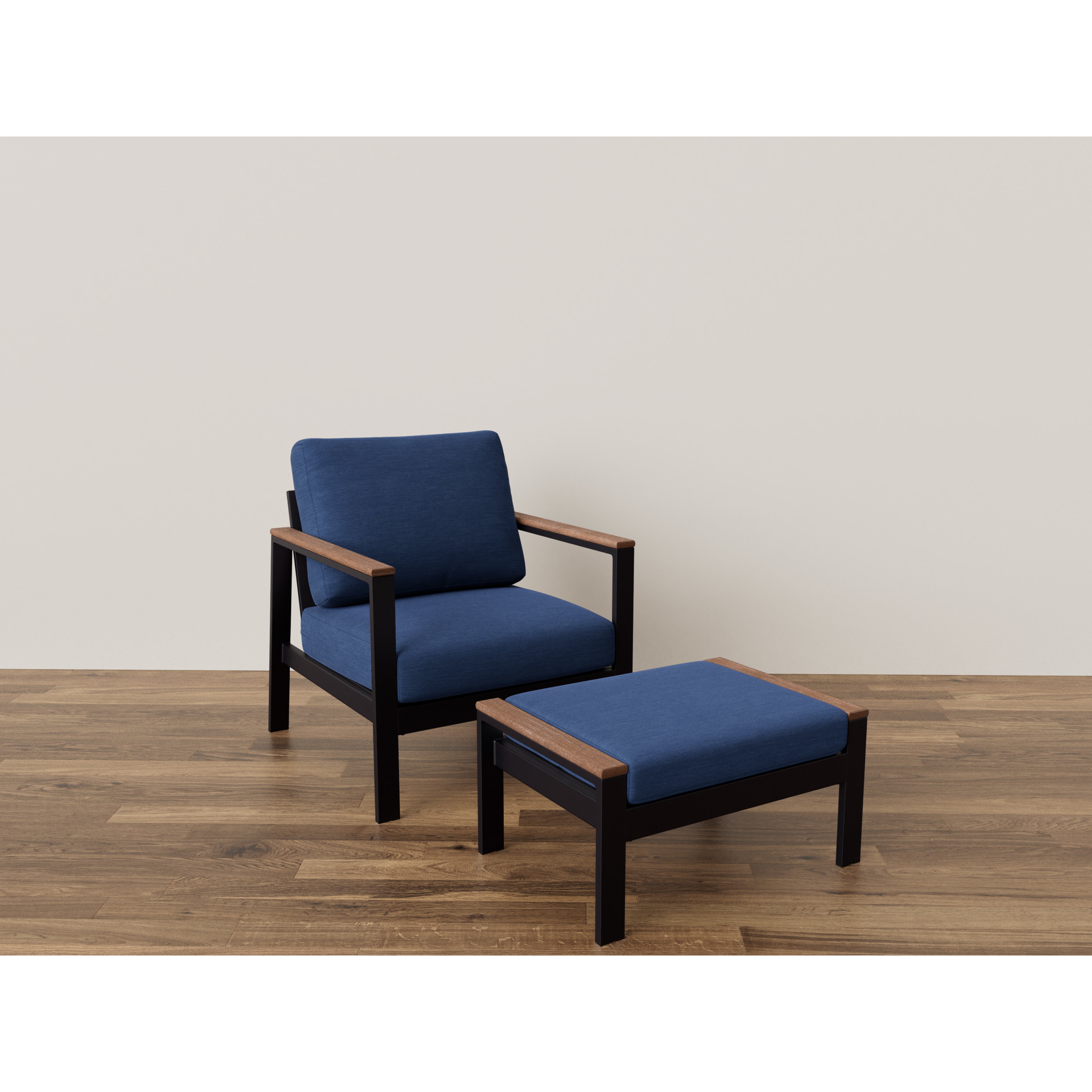 Modern armchair with blue cushions and matching ottoman on wood floor.
