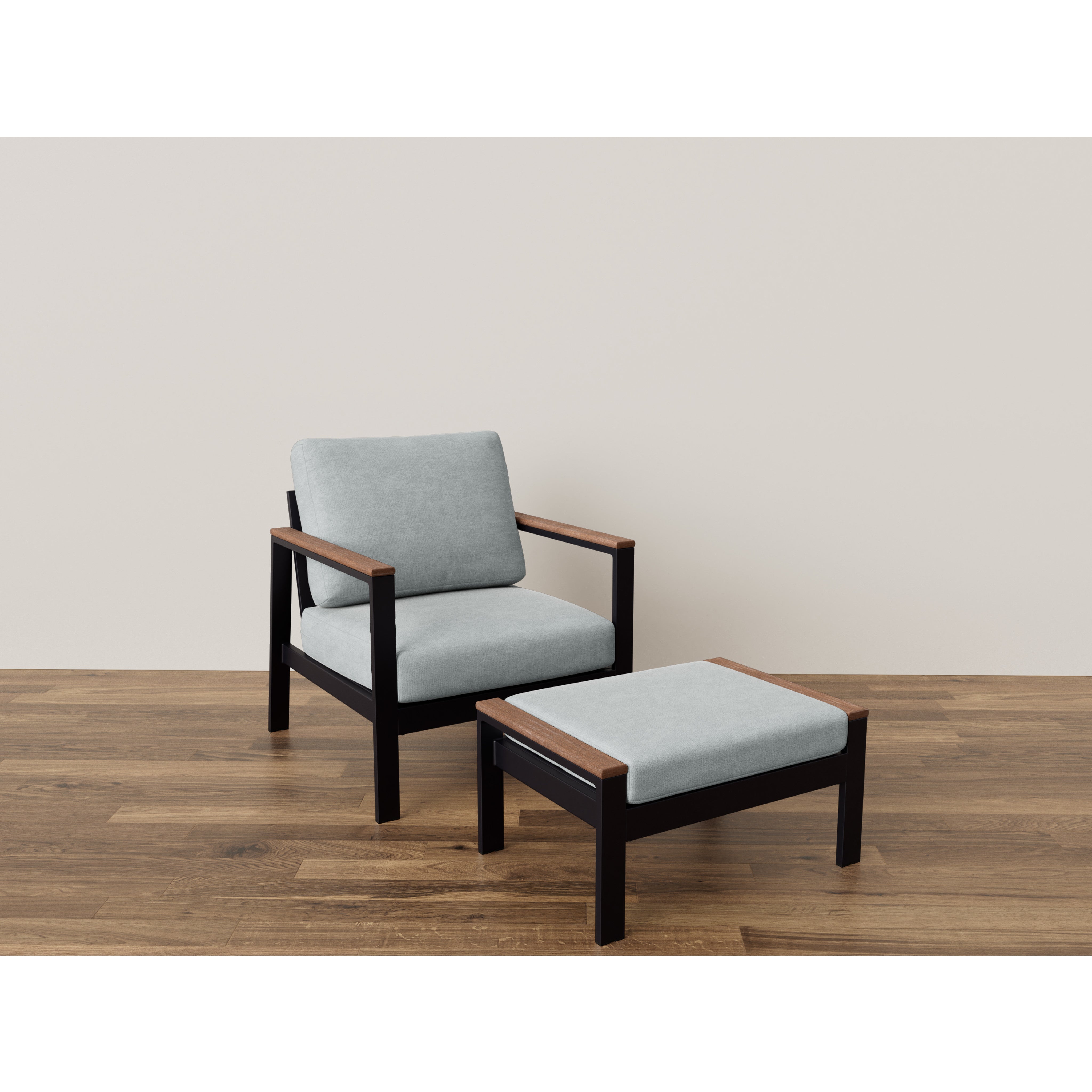 Modern accent chair with matching ottoman, light gray cushions and wood armrests.