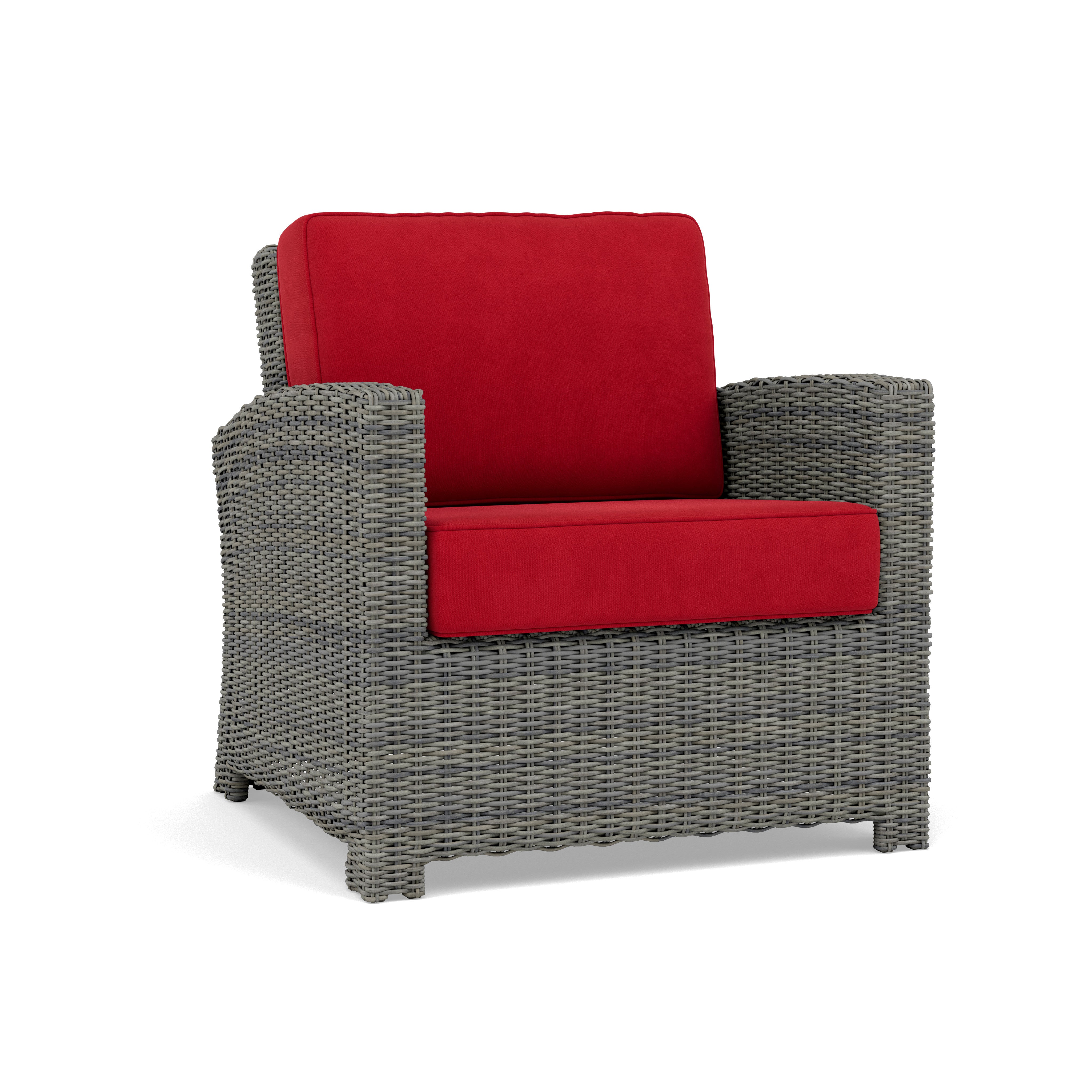 Gray wicker armchair with red cushions, suitable for outdoor or indoor seating.