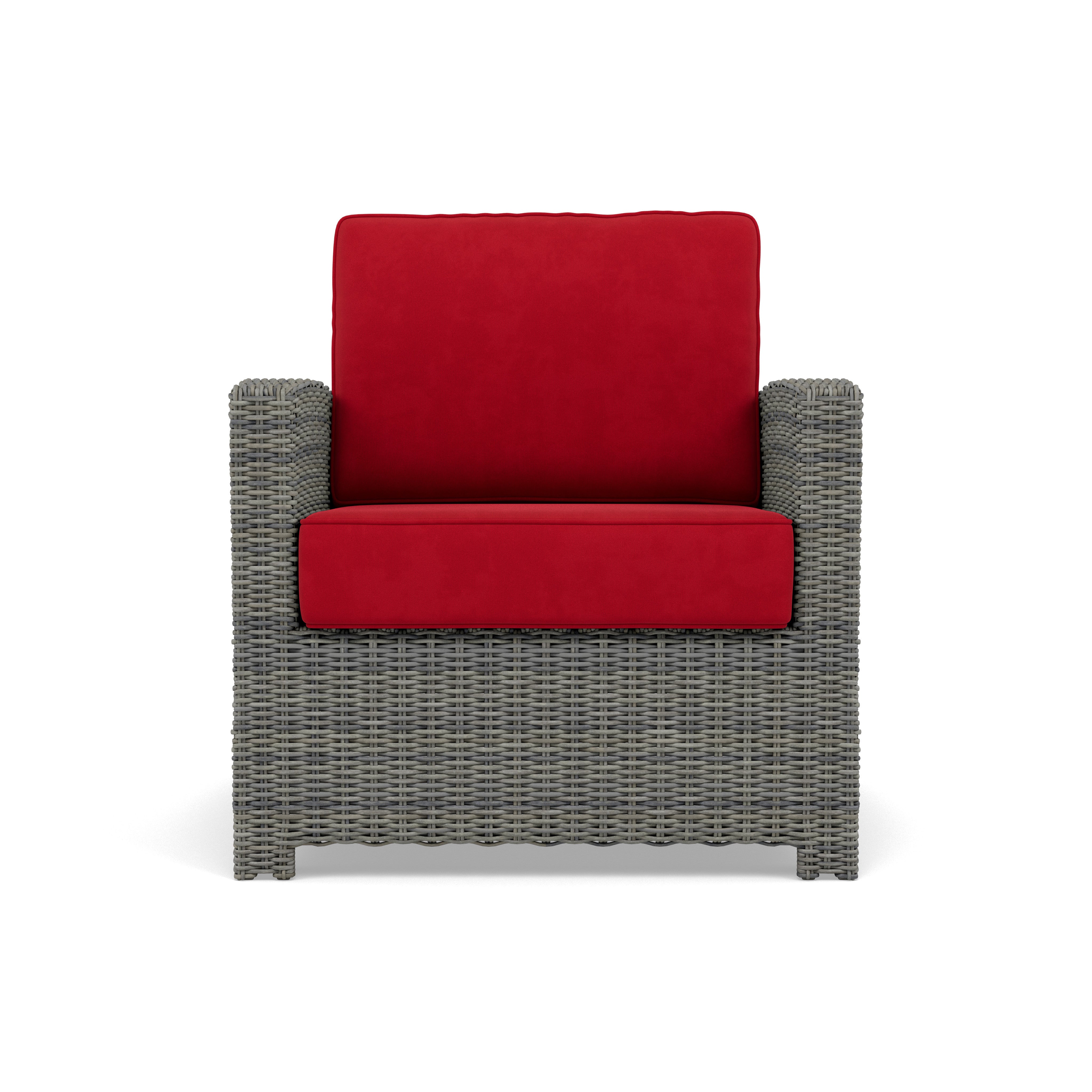 Gray wicker armchair with red cushions, front view.