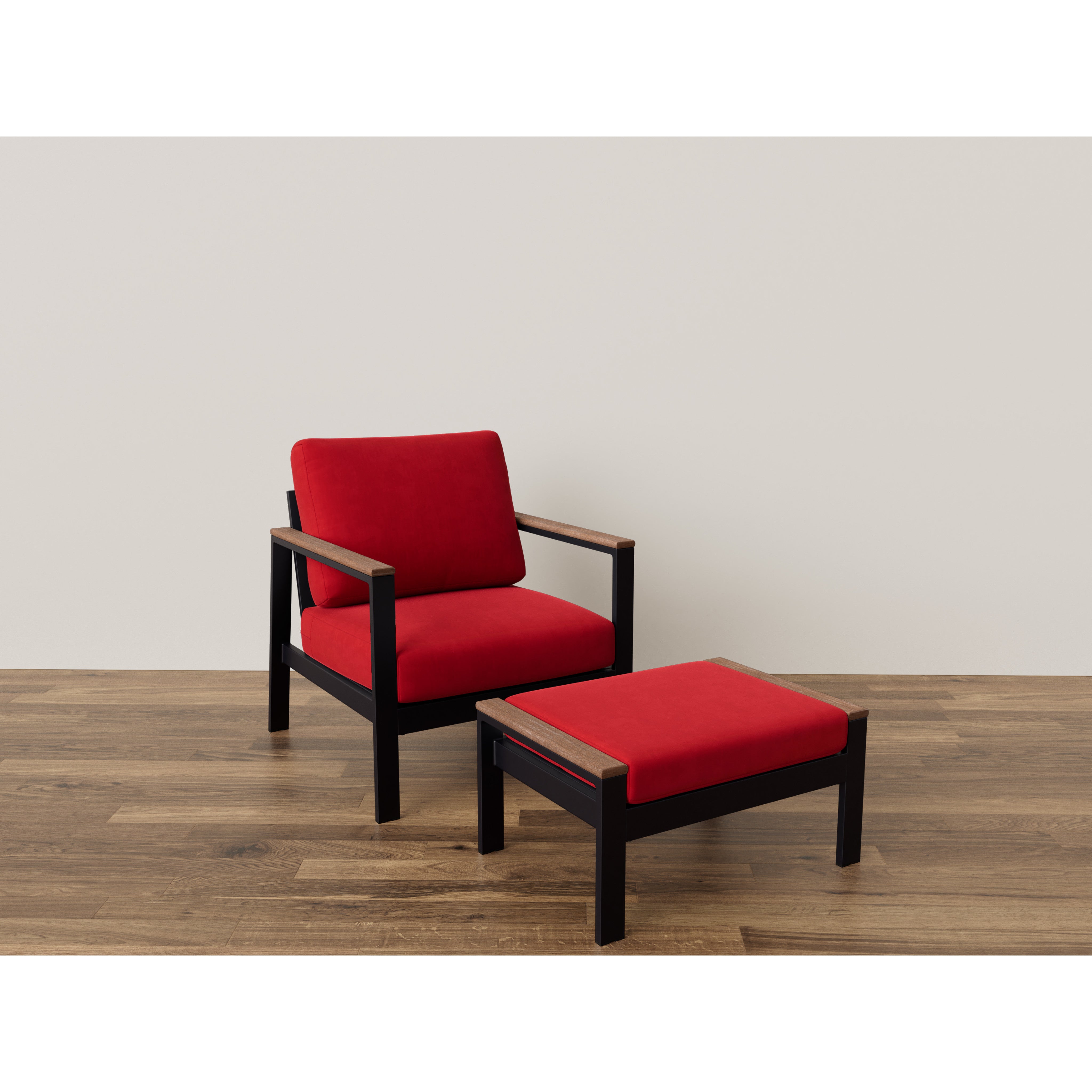 Modern armchair and ottoman with red cushions on wood floor.