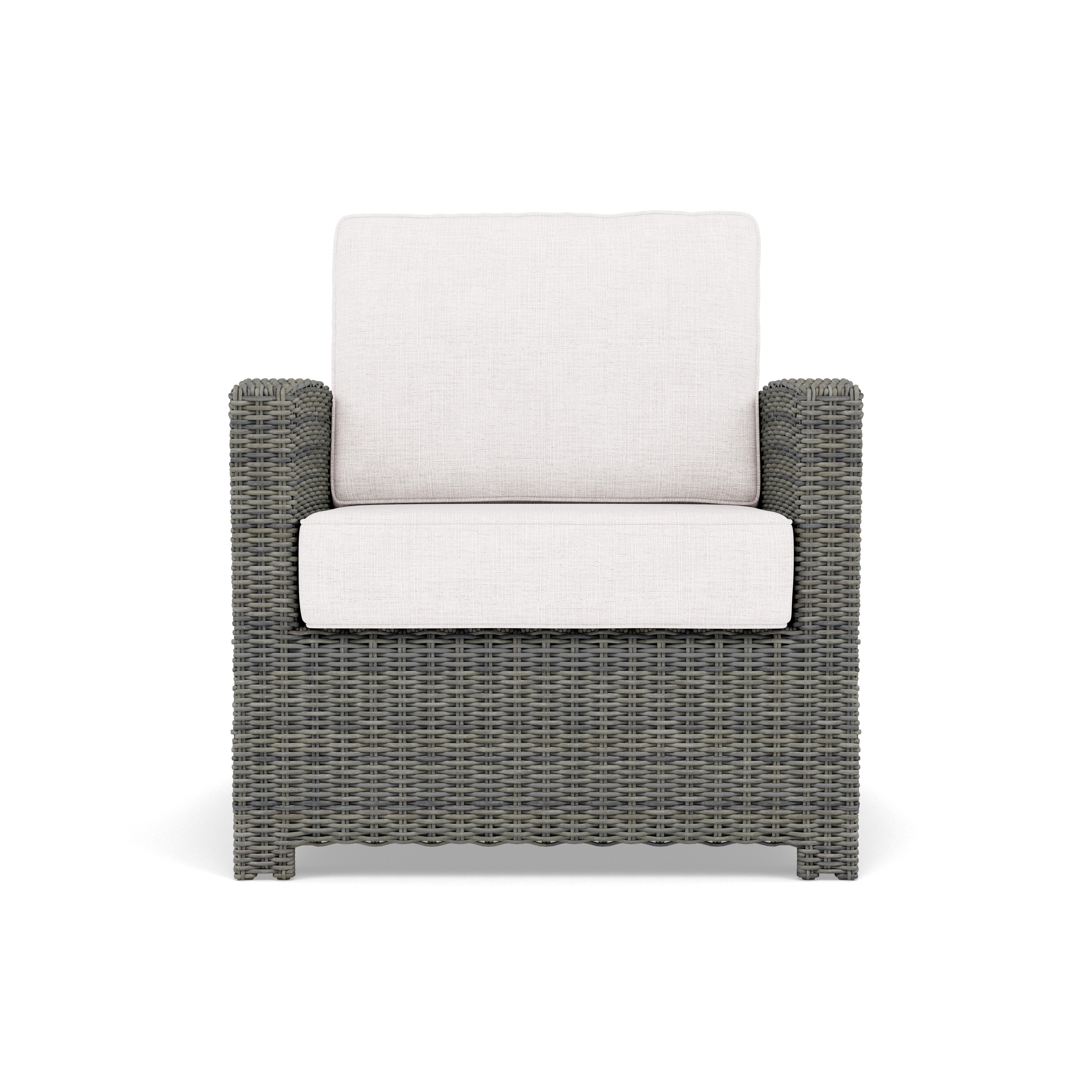 Front view of a modern outdoor armchair with grey wicker frame and light cushions.
