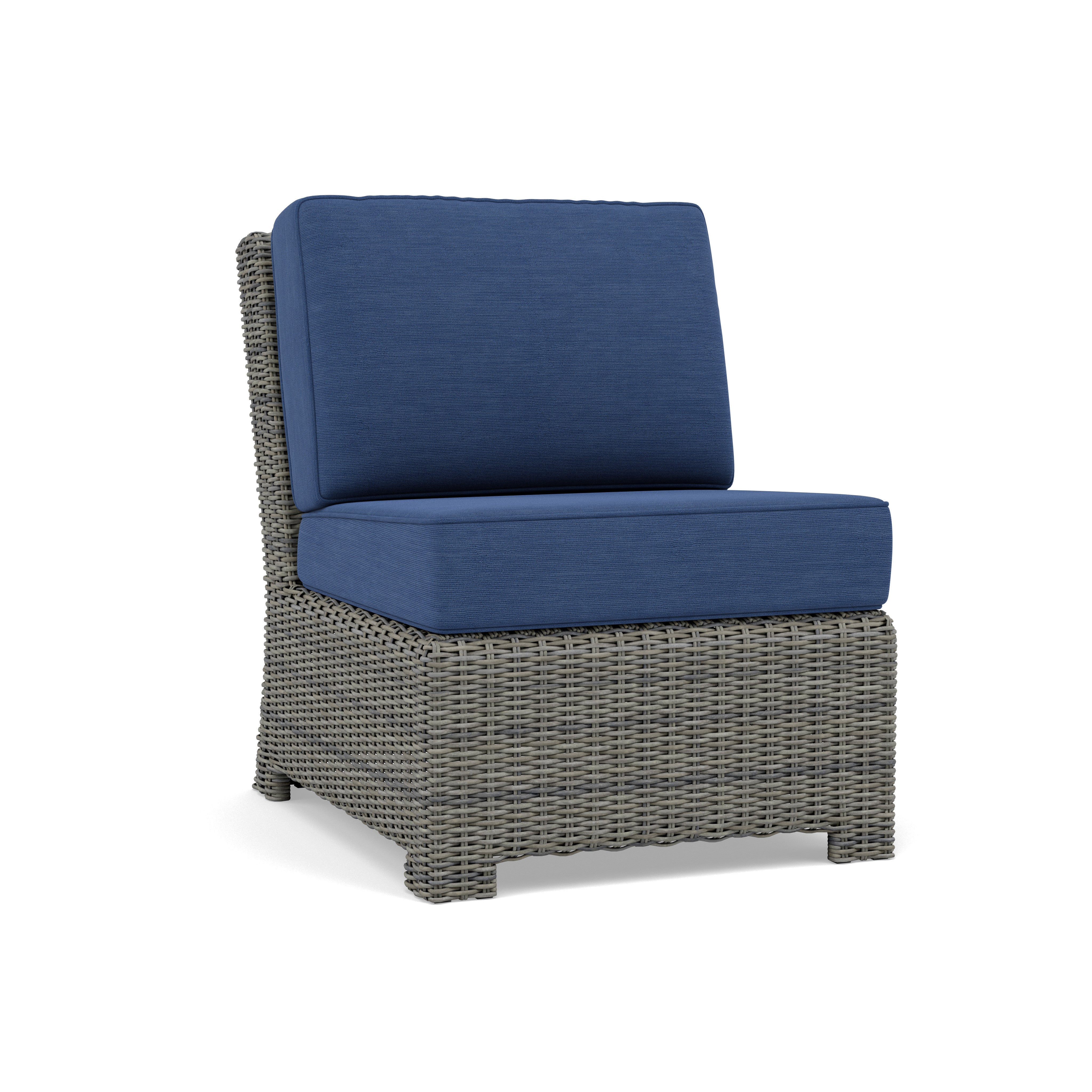 Wicker armless chair with blue cushions
