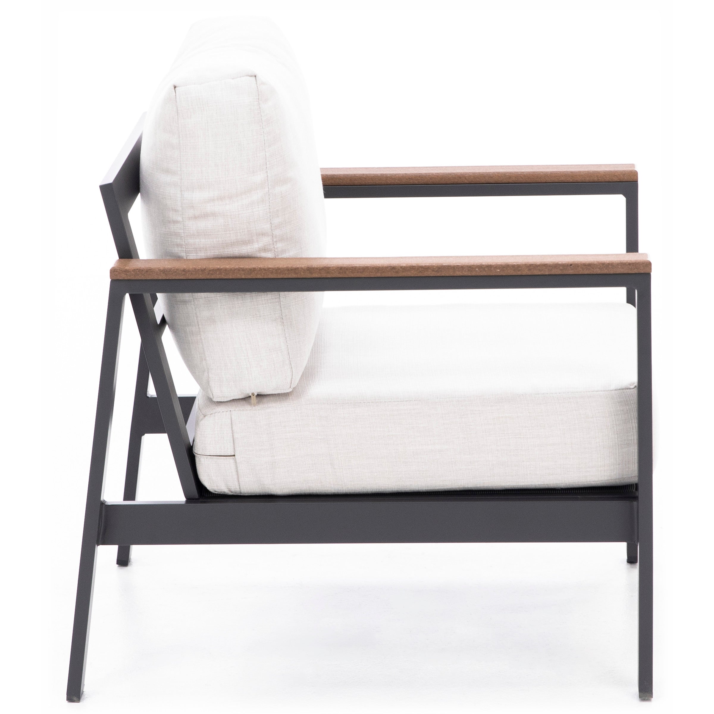 Side view of a modern armchair with light cushions and metal frame.