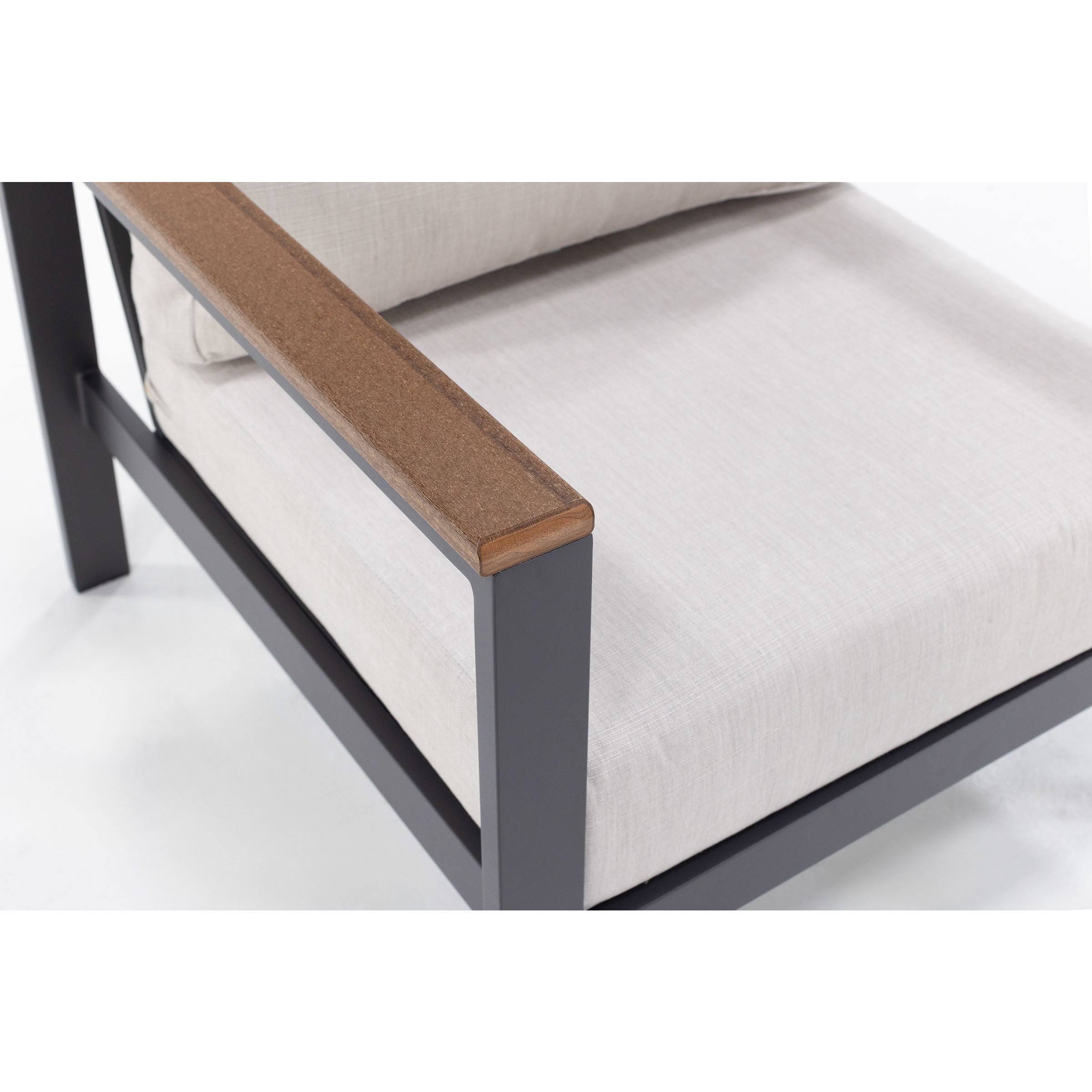 Close-up of a chair armrest with gray frame and light cushion.