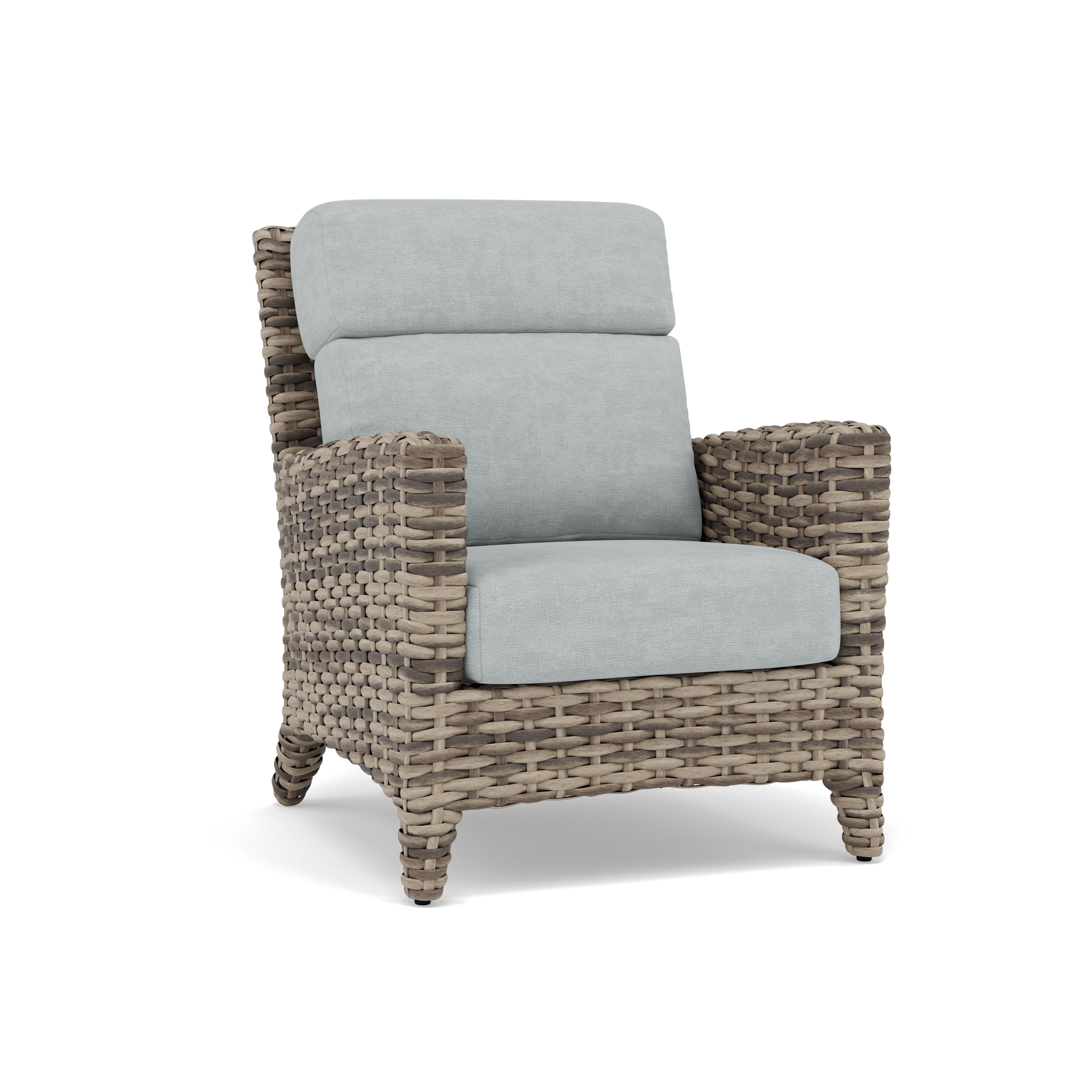 Woven rattan armchair with light grey cushions, angled for a clear view of the front and side.
