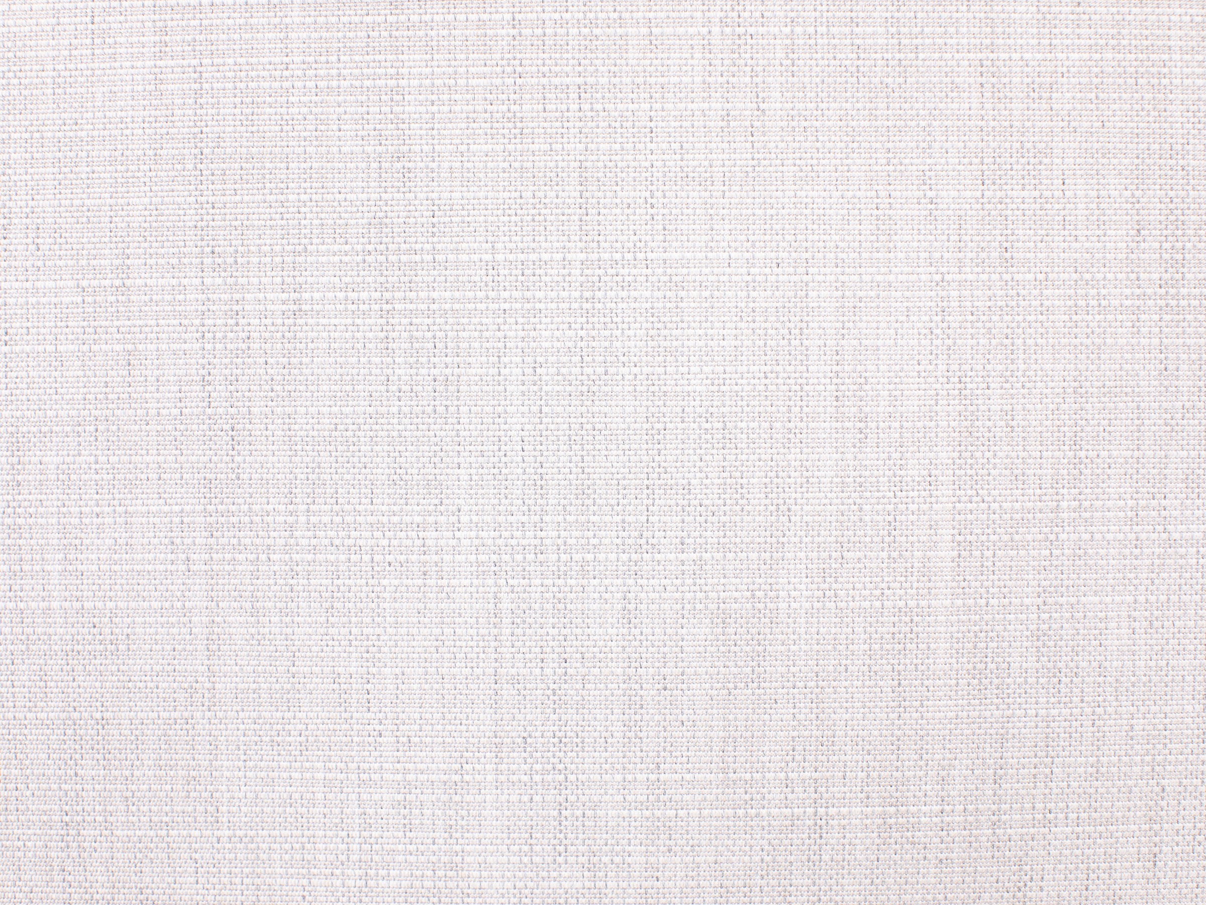 Close-up of off-white textured fabric for upholstery or decor.