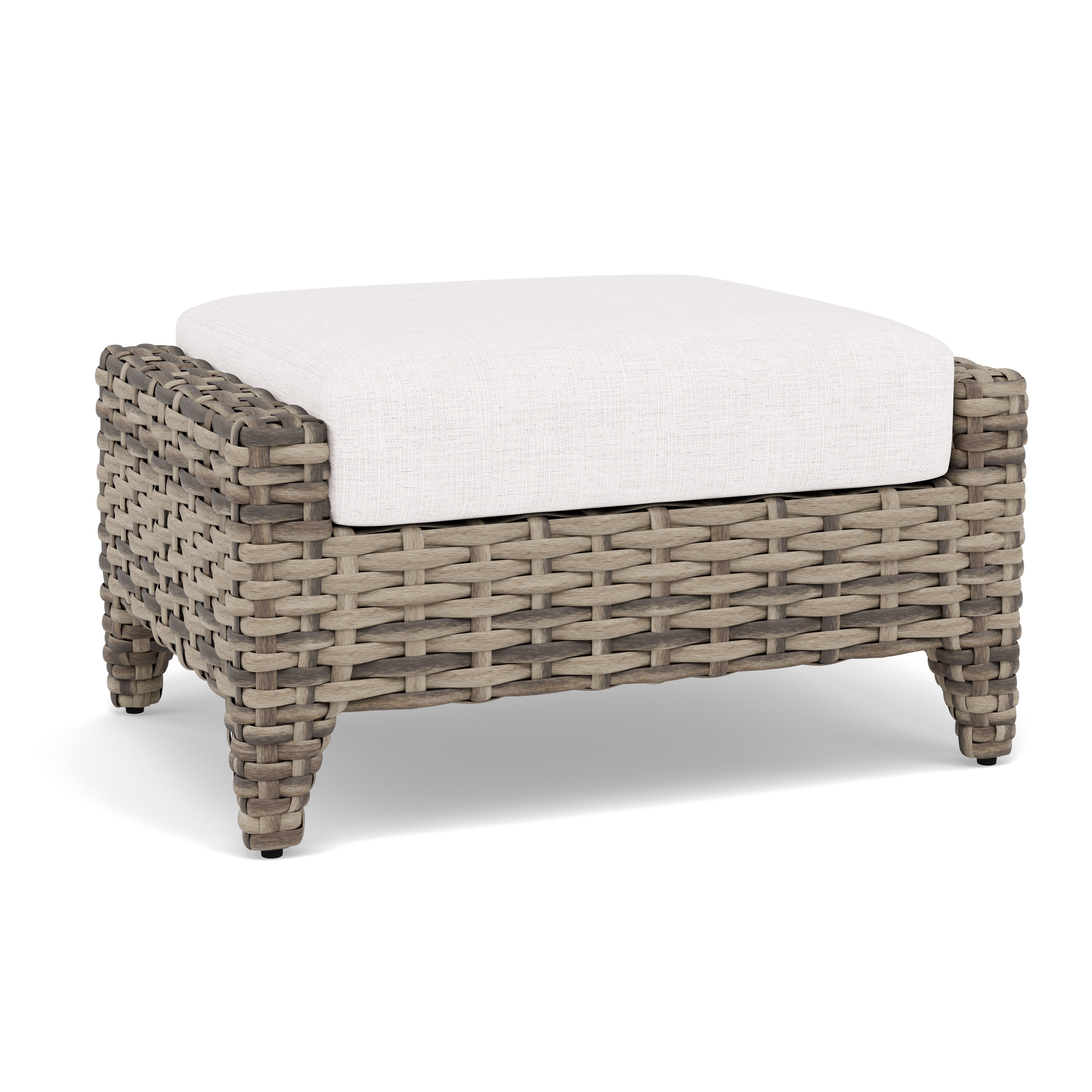 Woven ottoman with a light cushion, suitable for indoor or outdoor seating.