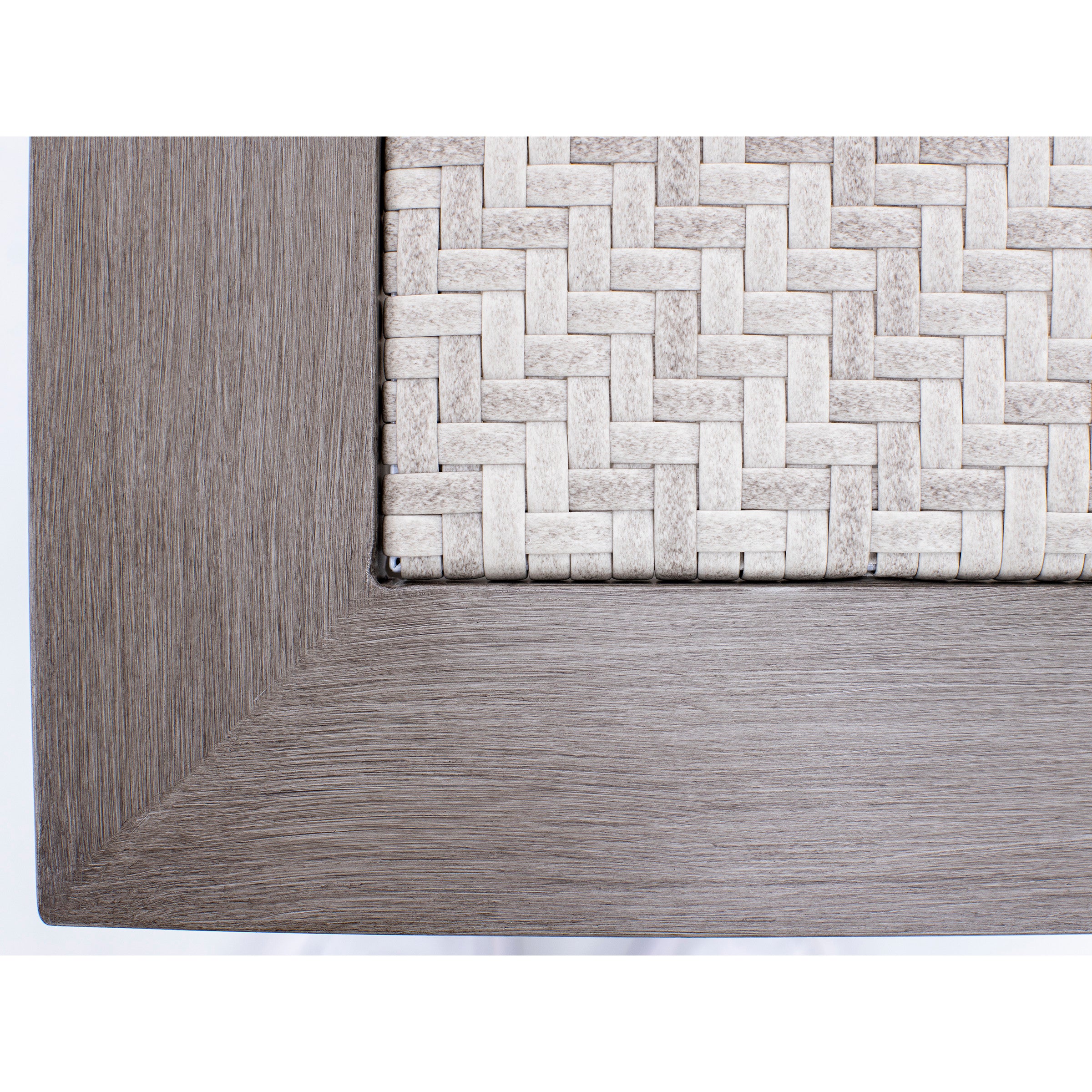 Close-up of a gray woven table top with wood textured frame.