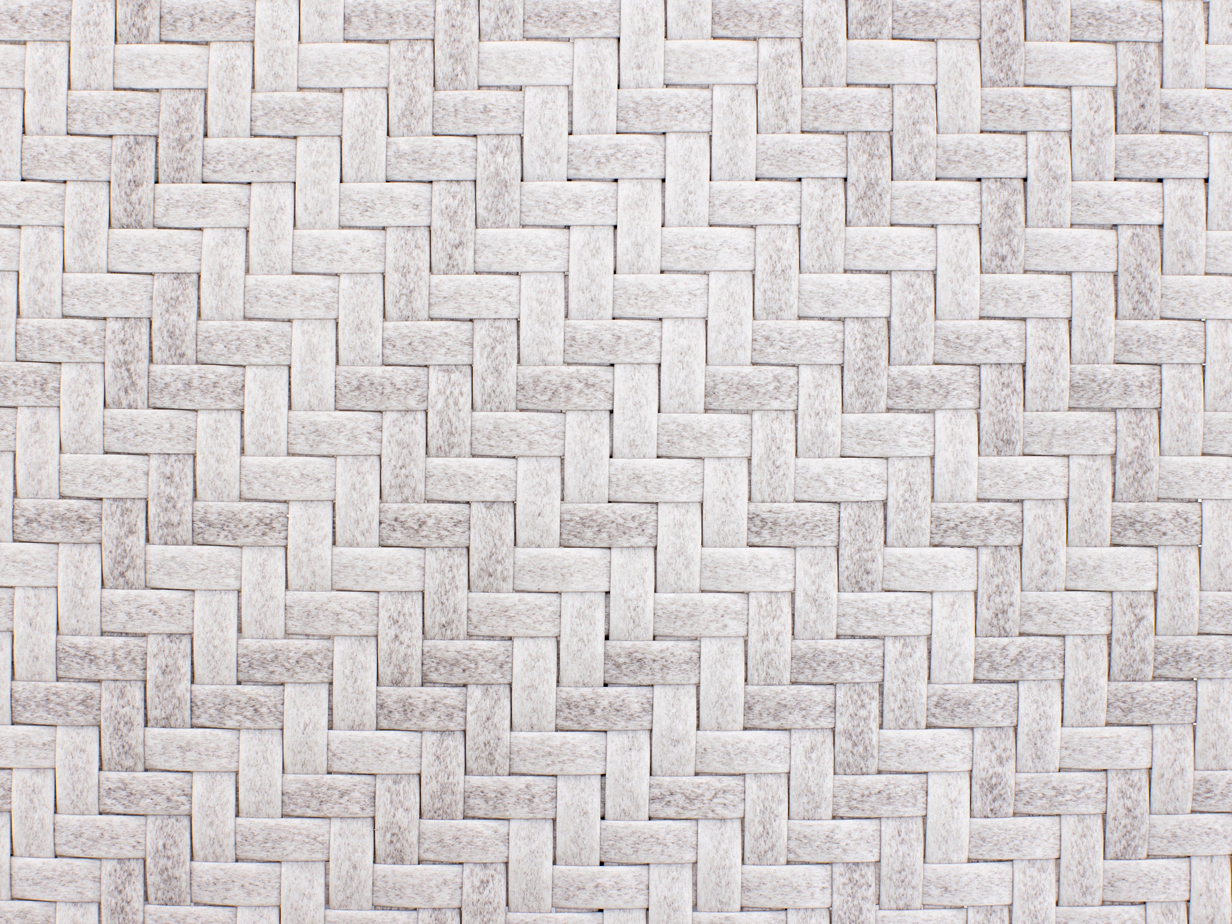 White woven texture pattern, resembling a basket weave, used as a background or surface.
