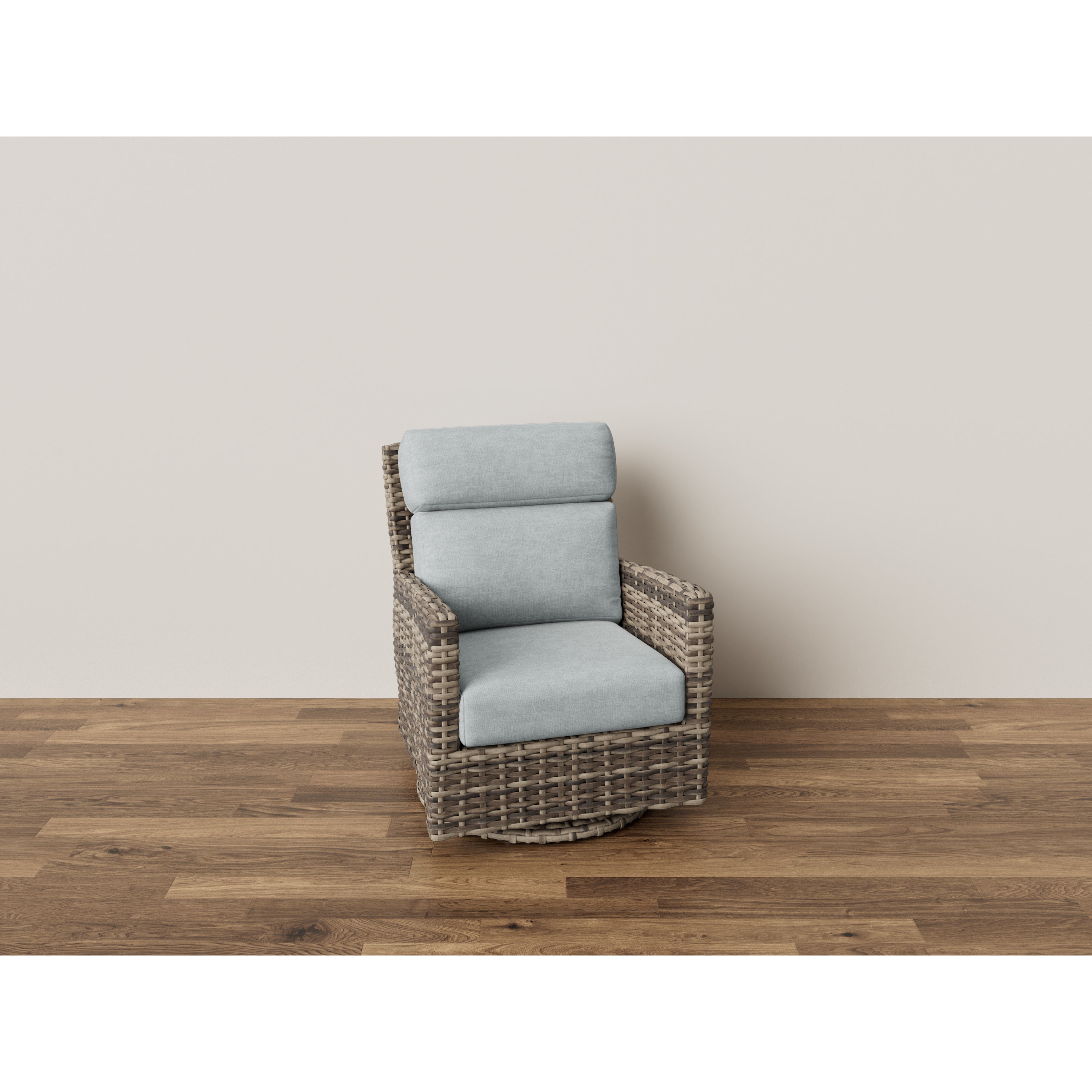 Woven rattan swivel chair with light gray cushions on wood floor.