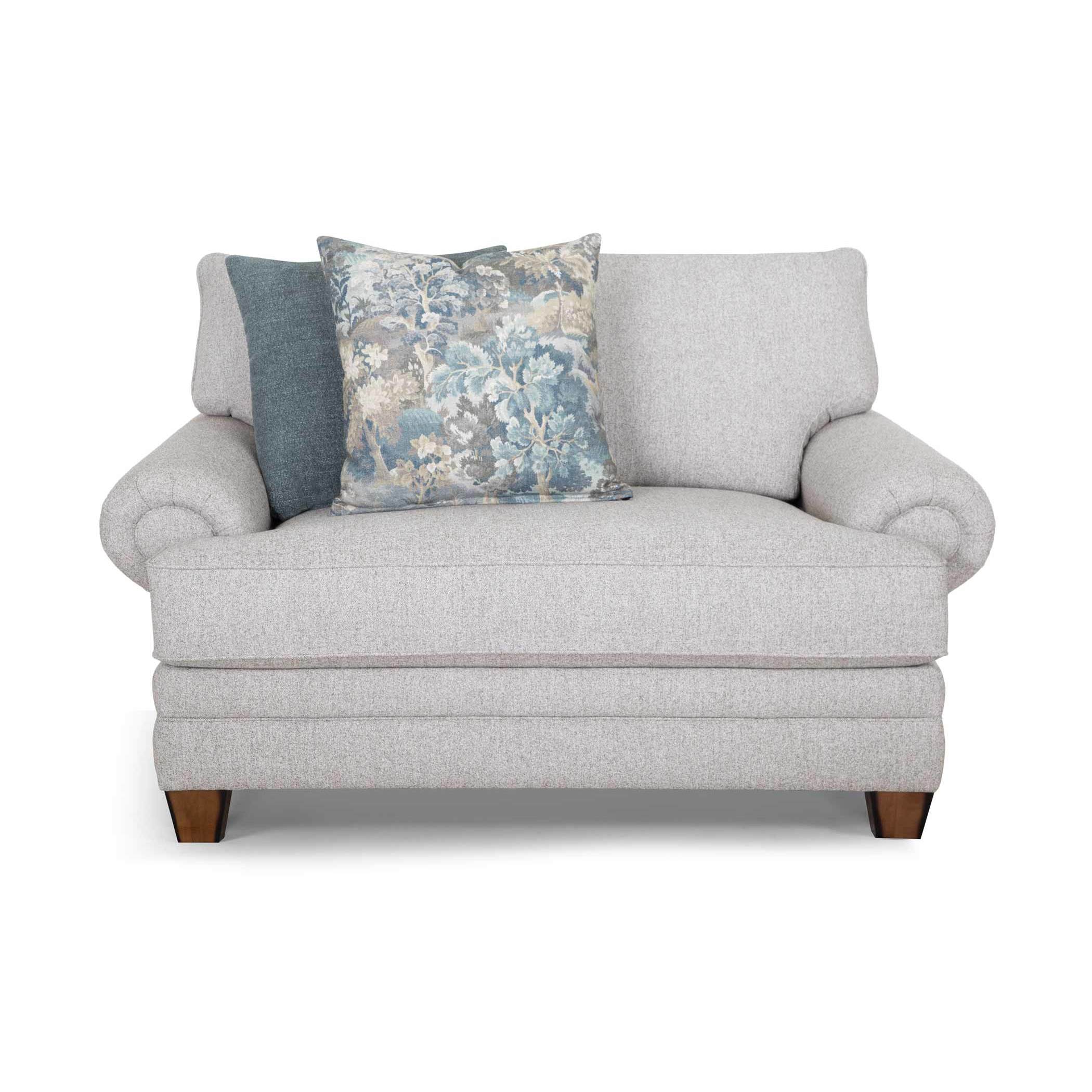 Light gray loveseat with rolled arms and two decorative pillows, front view.