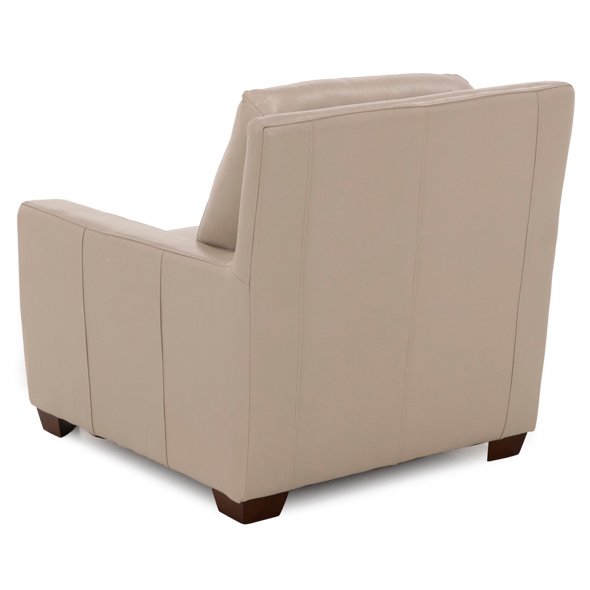 Back view of a beige armchair with short wooden legs.