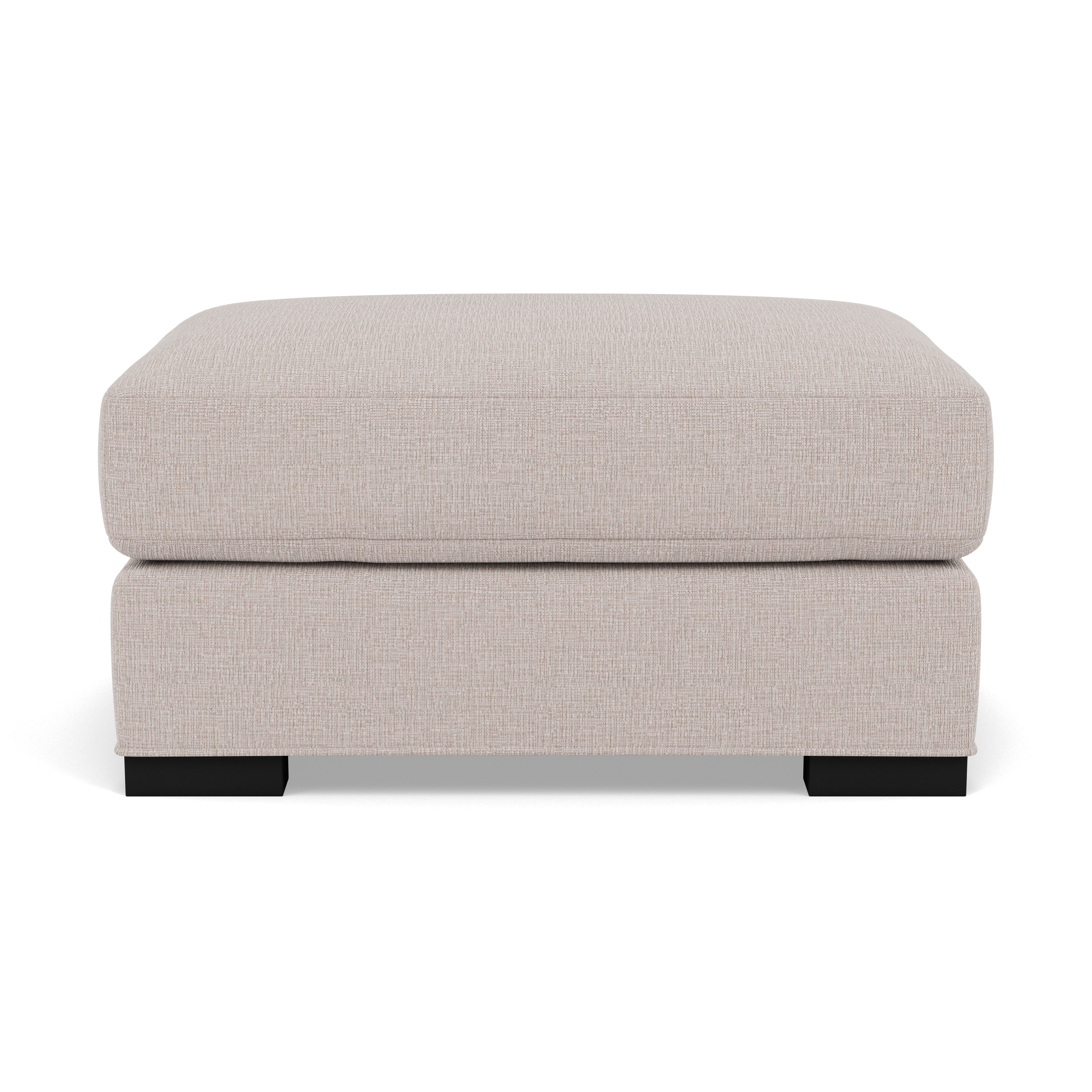 Beige upholstered ottoman with block wood legs, front view.