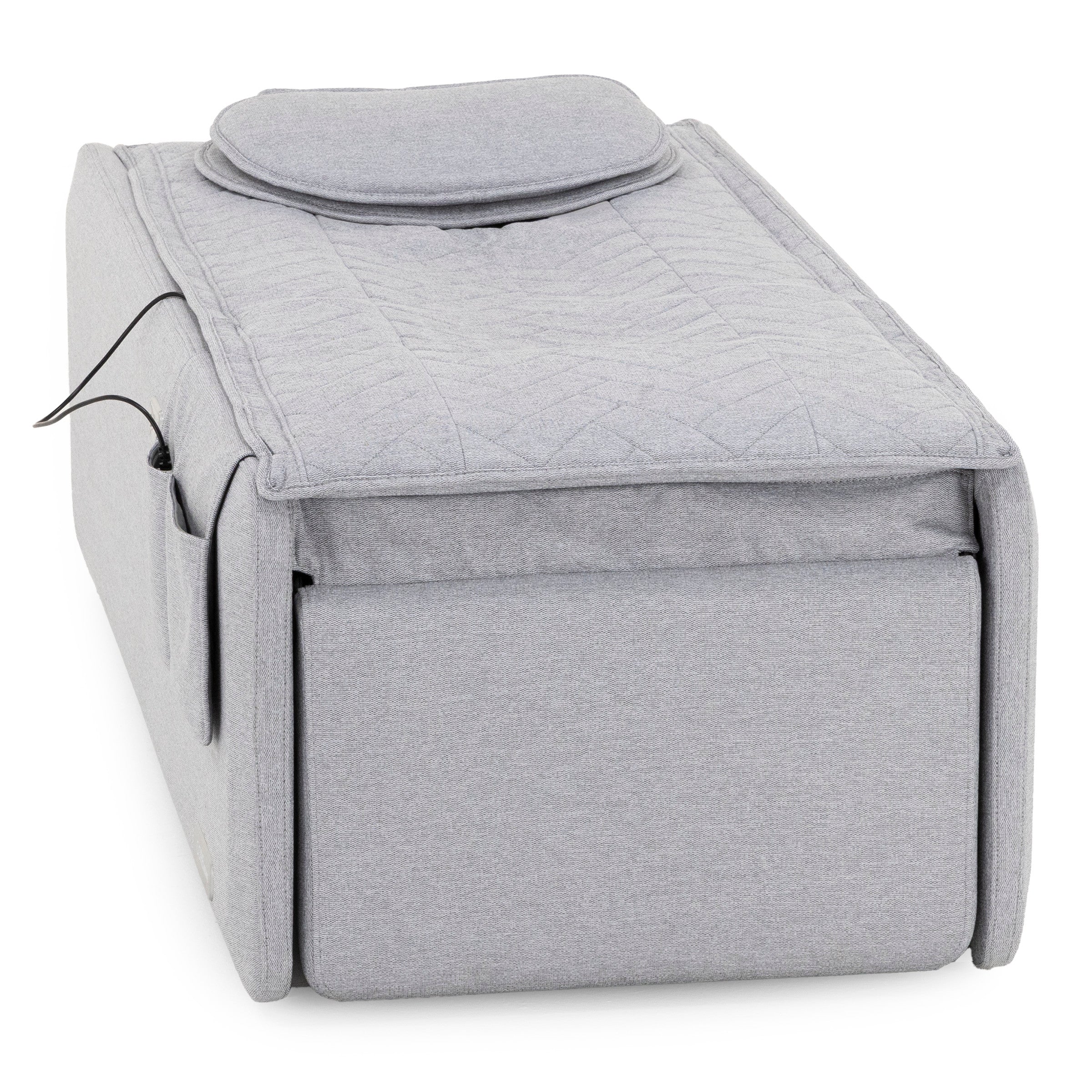 Light gray rectangular ottoman with a removable padded top and side pocket.