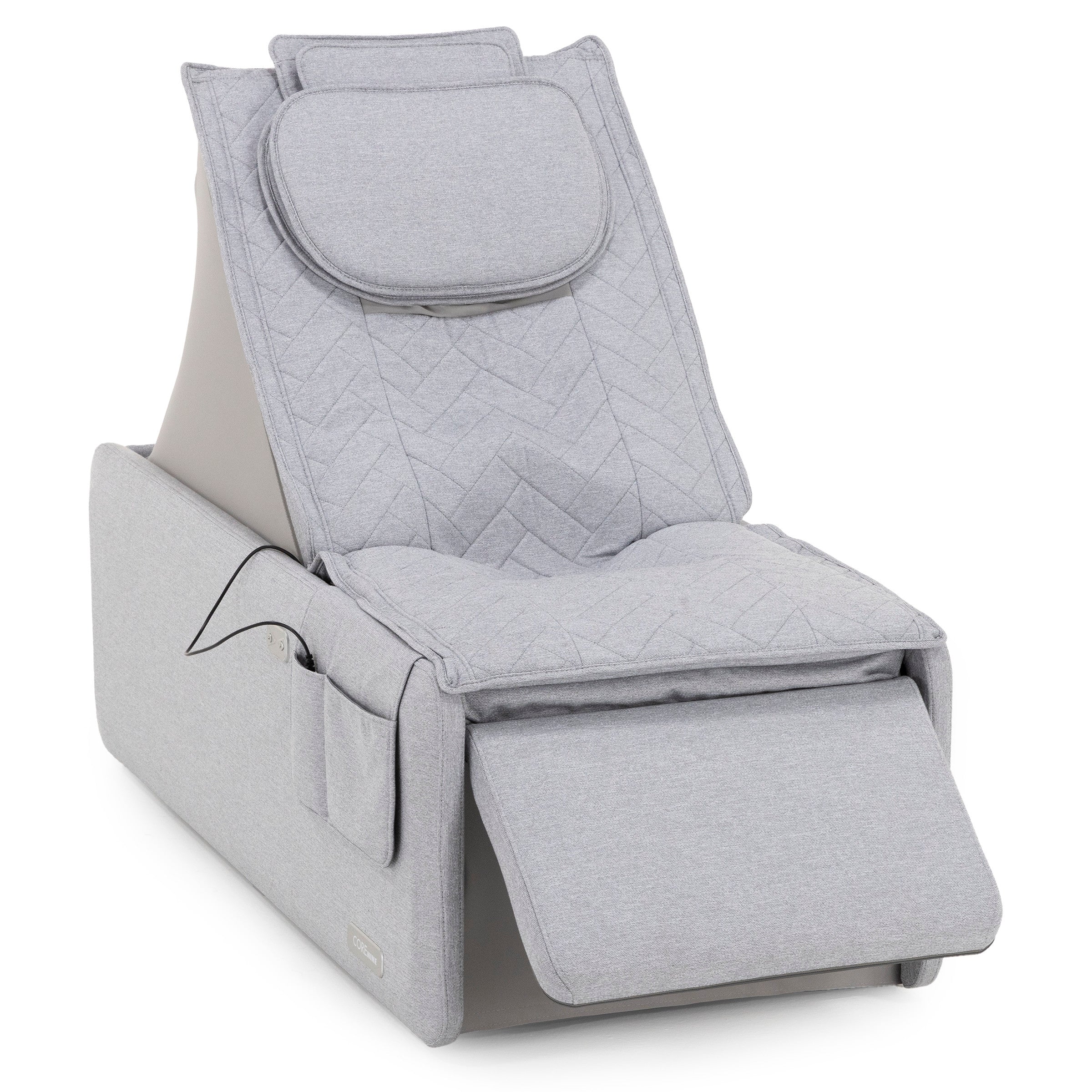 Light gray upholstered lounge chair with cushioned headrest and leg support.