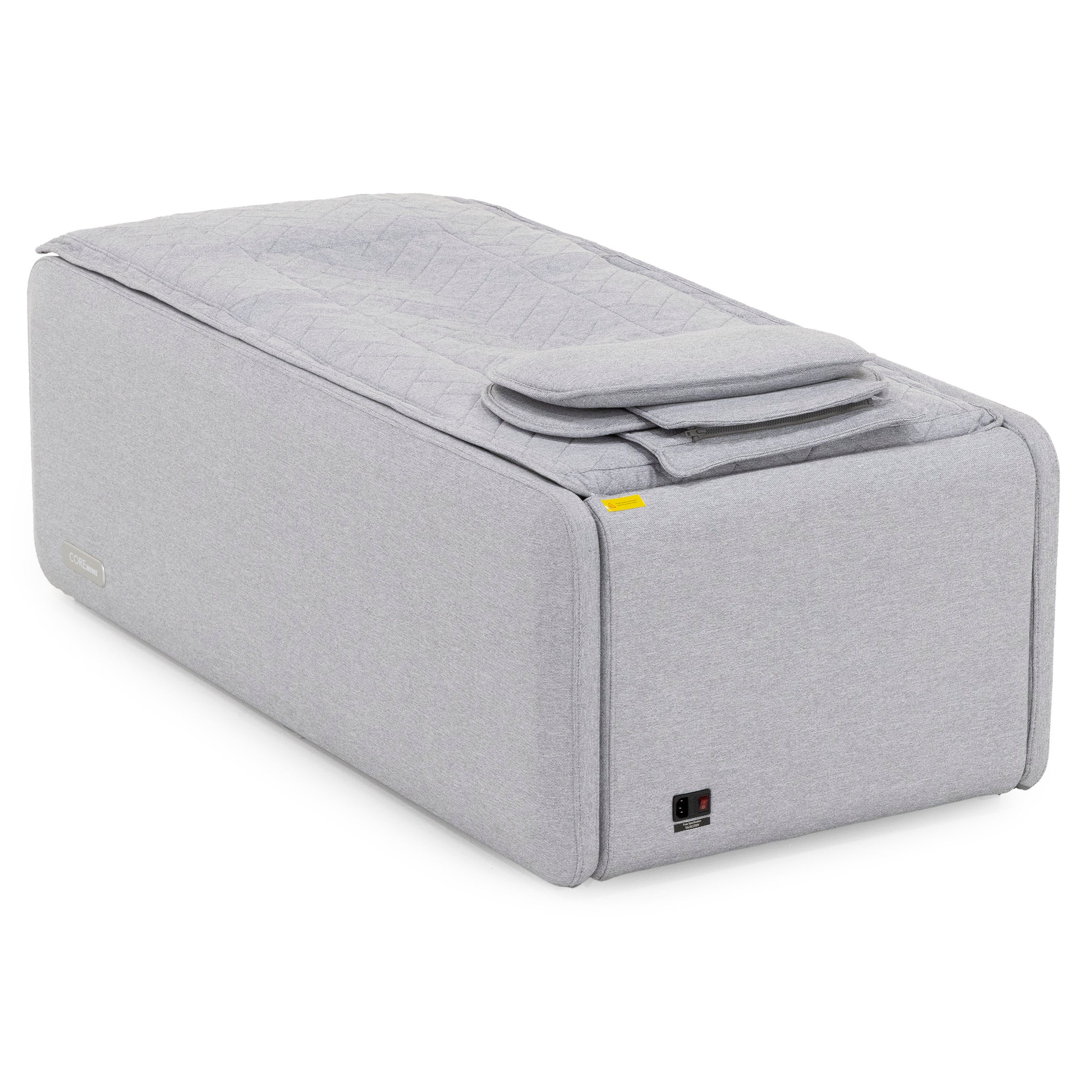 Light gray rectangular ottoman with a quilted top and foldable cushion.