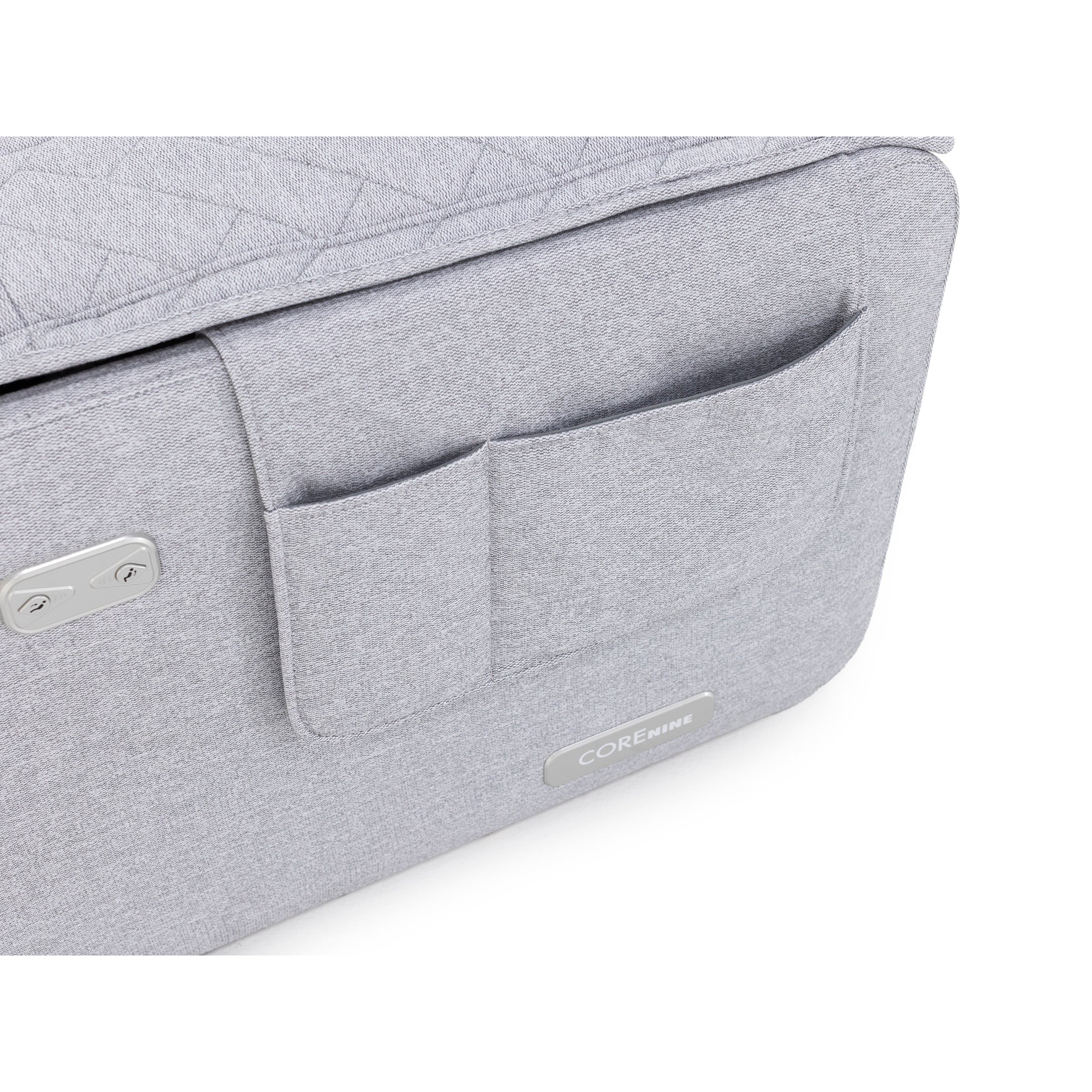 Close-up of a gray fabric storage pocket on an upholstered product, labeled COREnine.