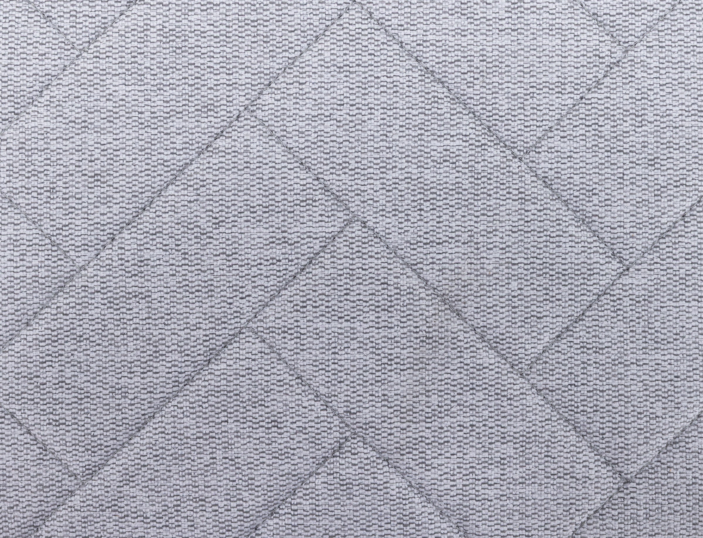 Light gray fabric with a subtle woven texture in a geometric, herringbone pattern.