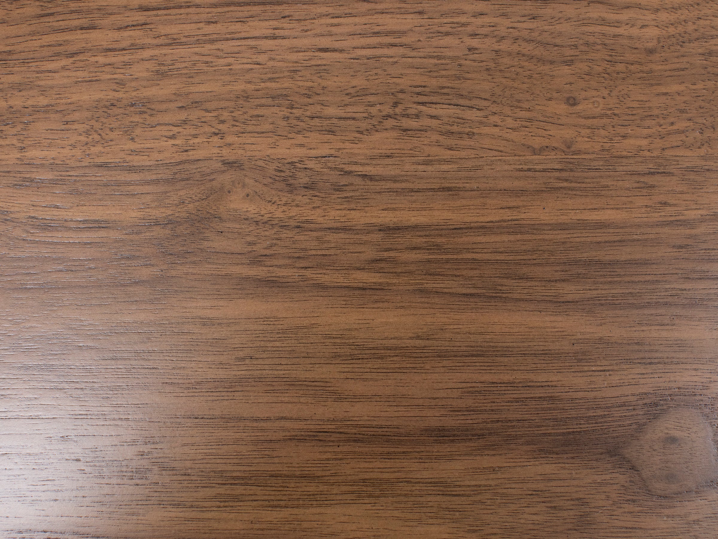 Wood surface with medium brown finish and visible grain pattern.