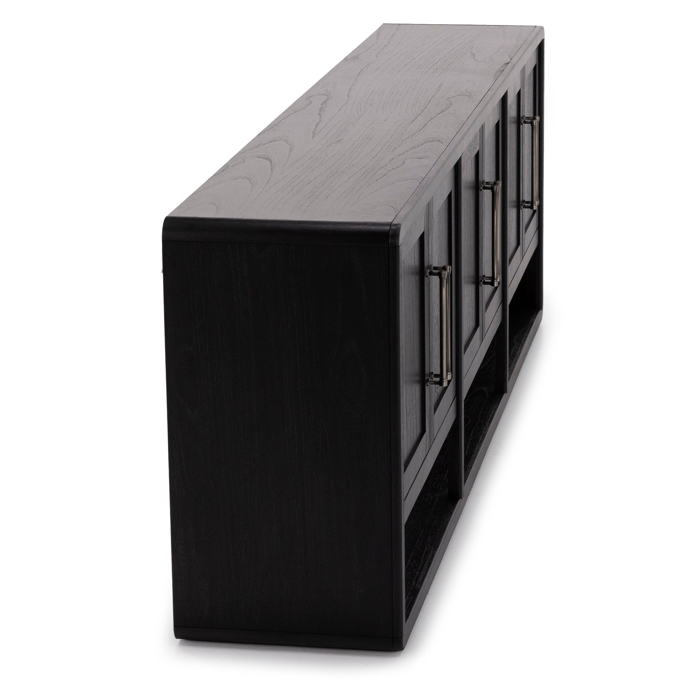 Angled view of a modern black wood console table with four cabinet doors and metal handles.