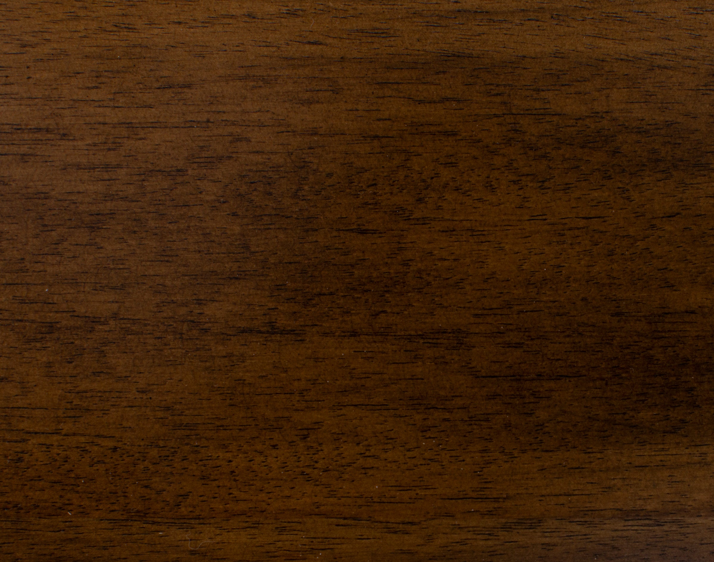 Close-up of medium brown wood grain texture.