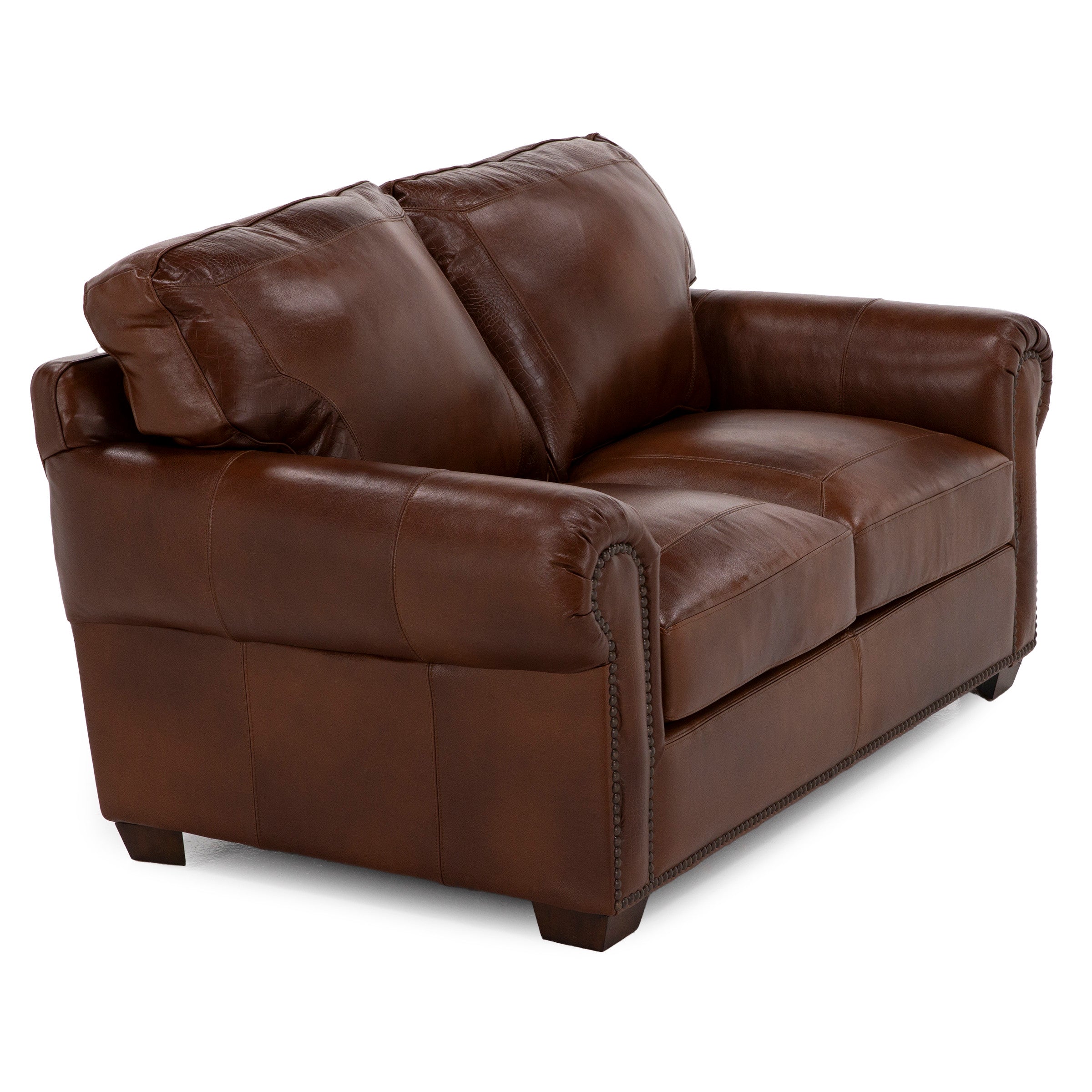 Brown leather loveseat with rolled arms and nailhead trim.