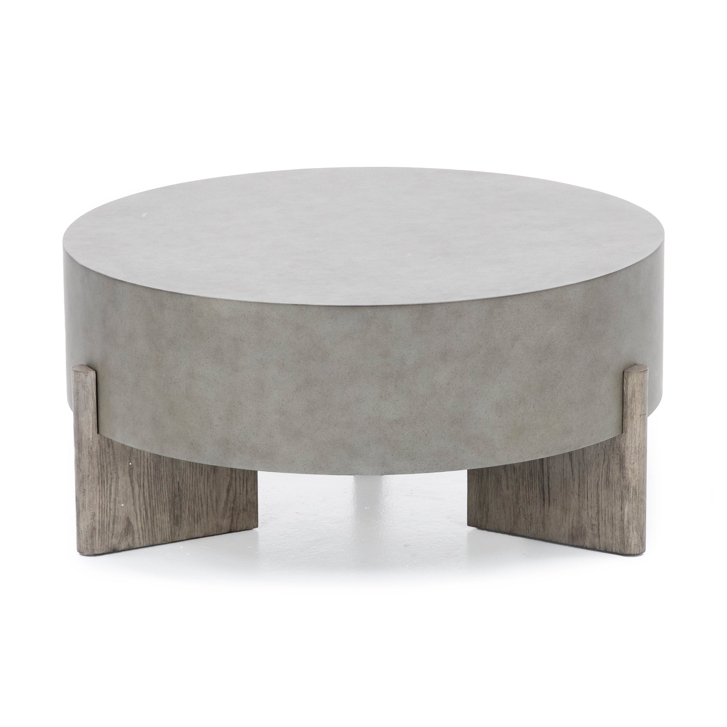 Round modern coffee table with a gray top and wooden legs.