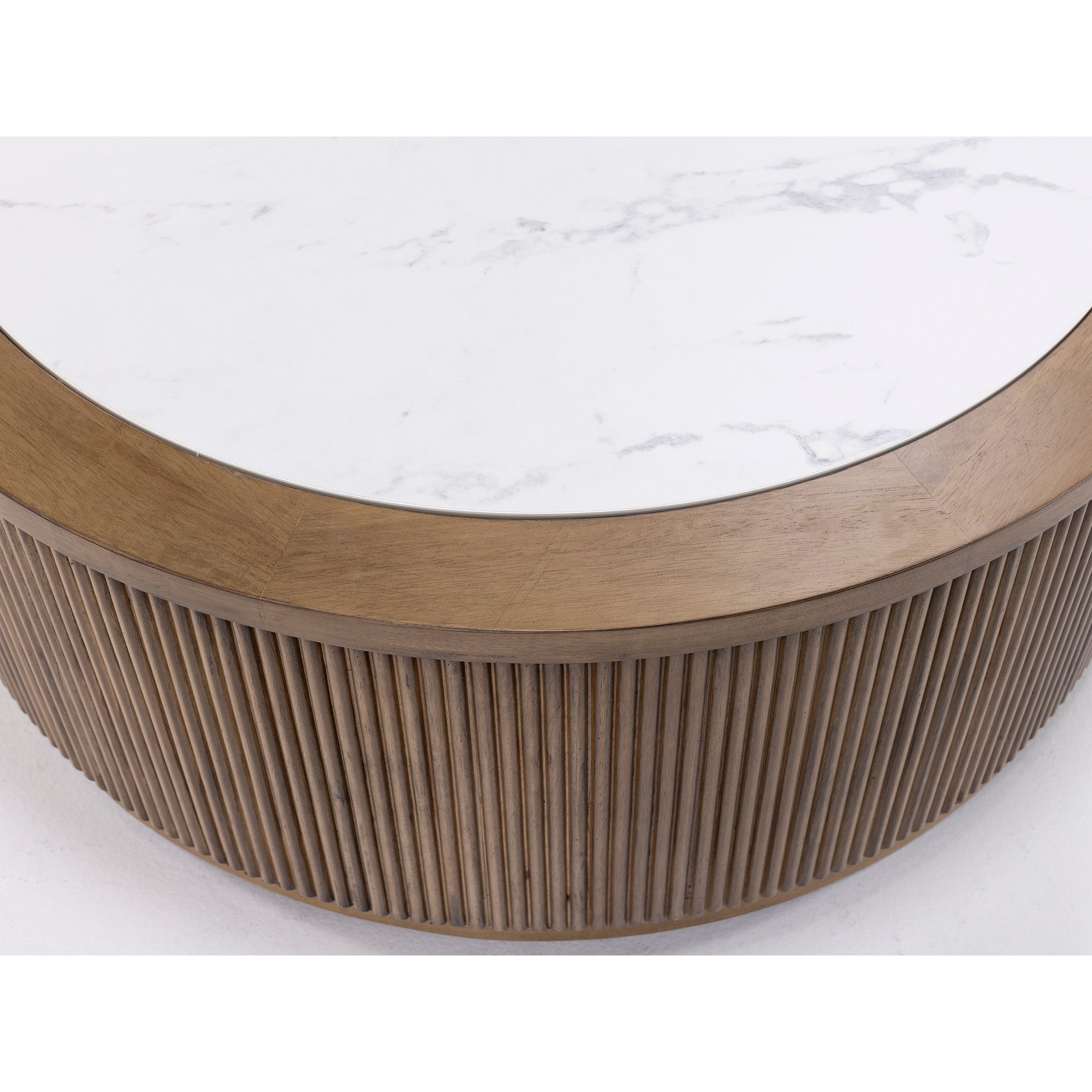 Round coffee table with white marble top and fluted wood base.