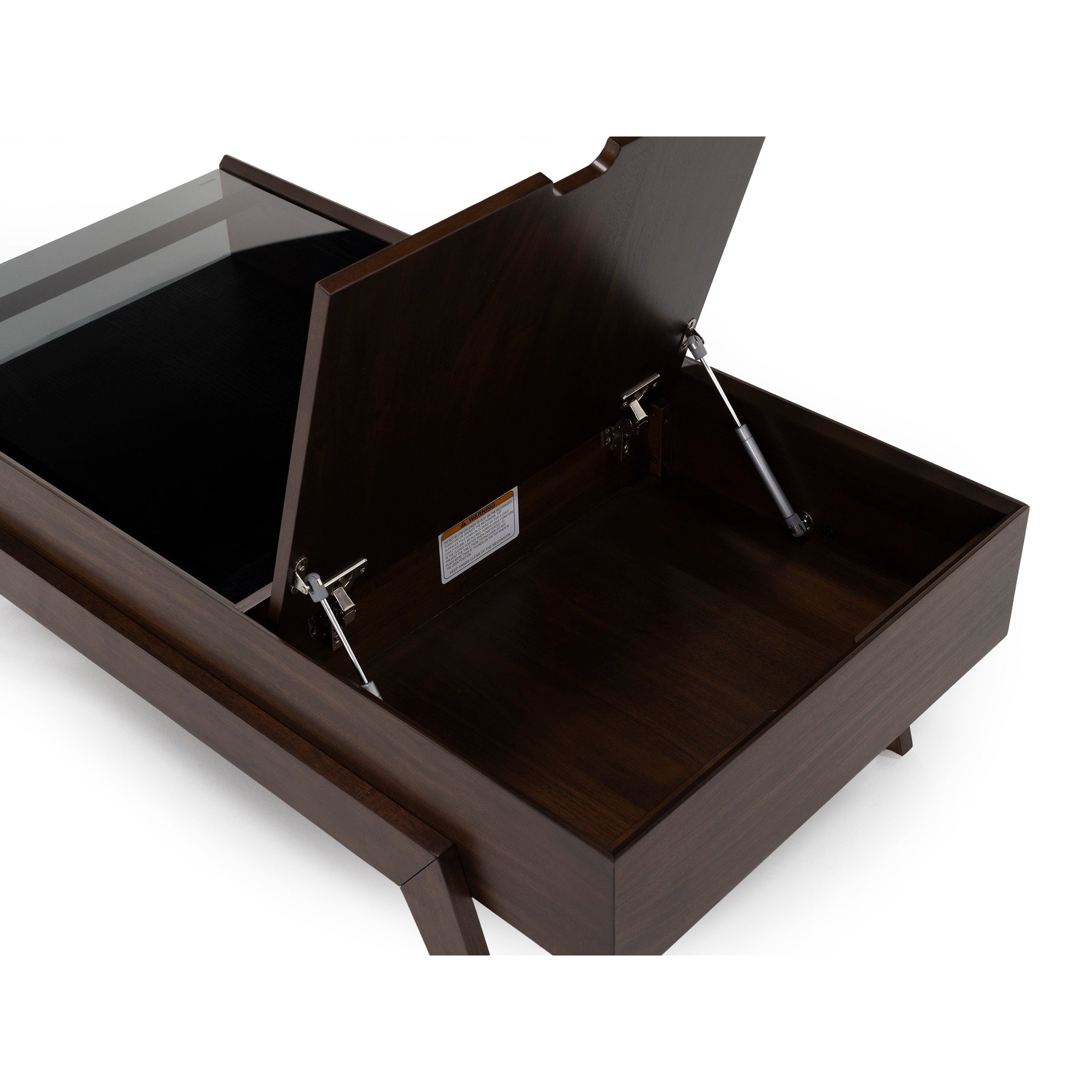 Open storage compartment inside a dark wood coffee table with a lift-top design.