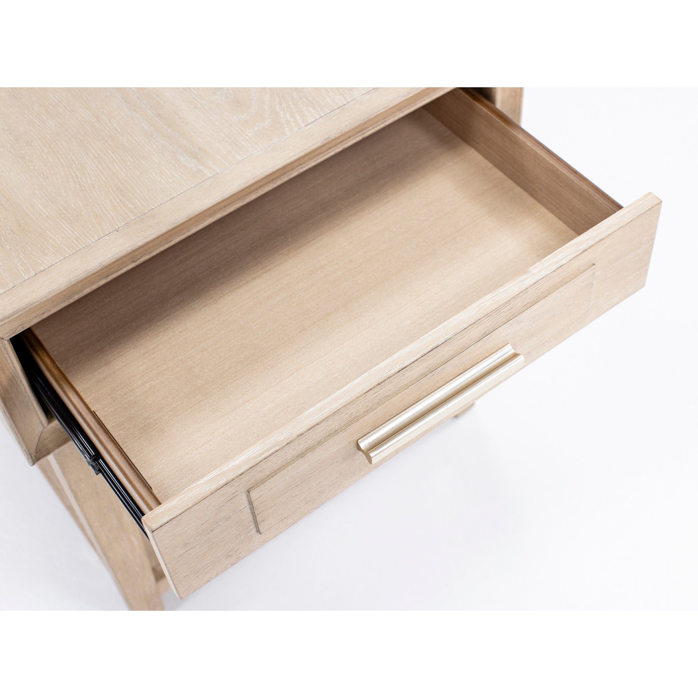 Open wooden drawer with metal handle, shown from above.