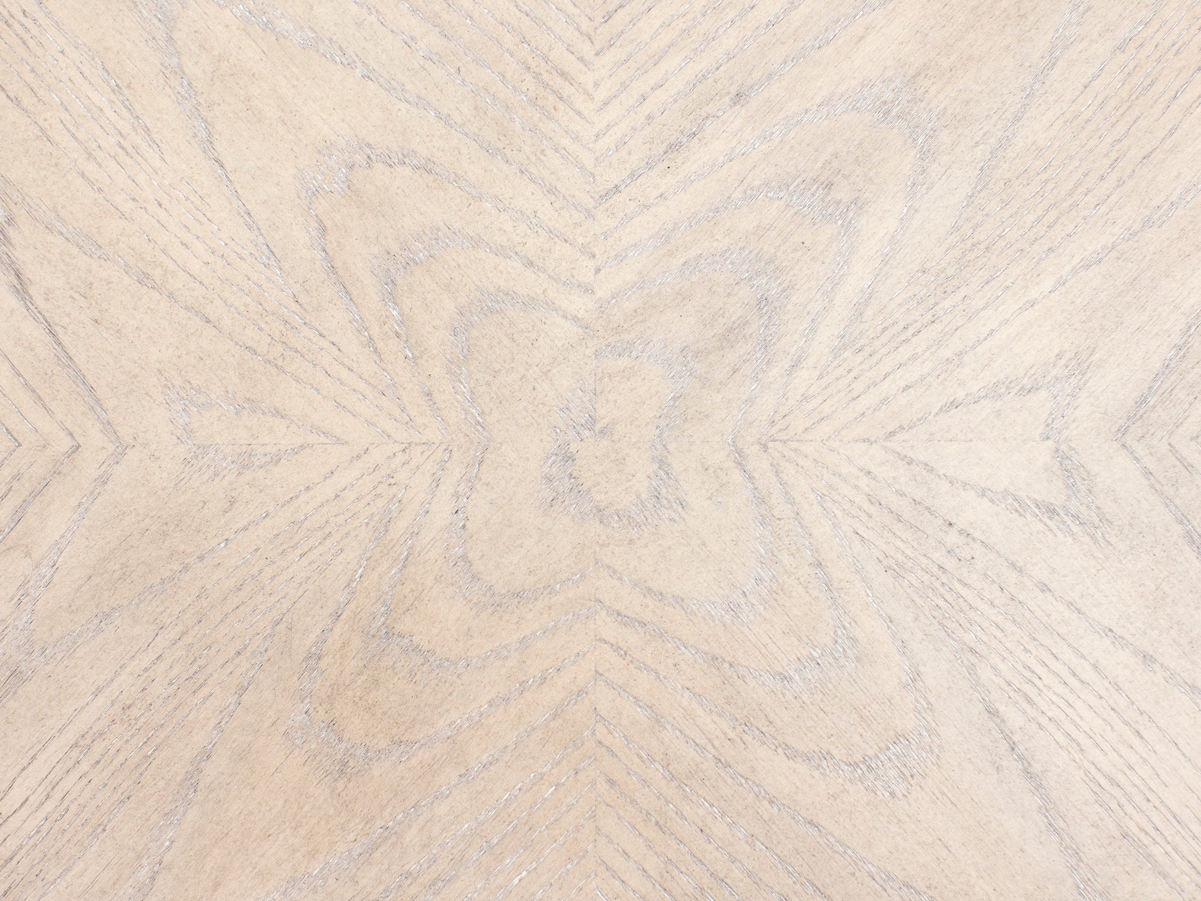 Light wood surface with geometric grain pattern.