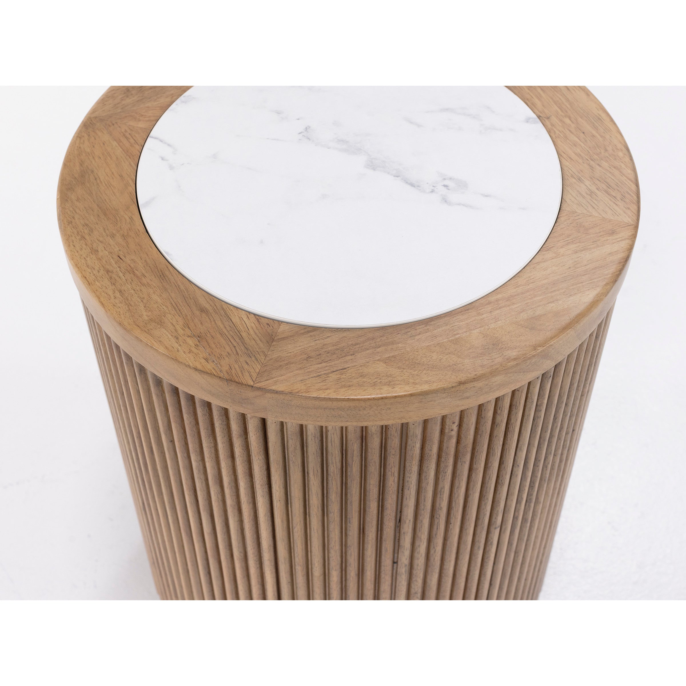Round side table with fluted wood base and white marble top.