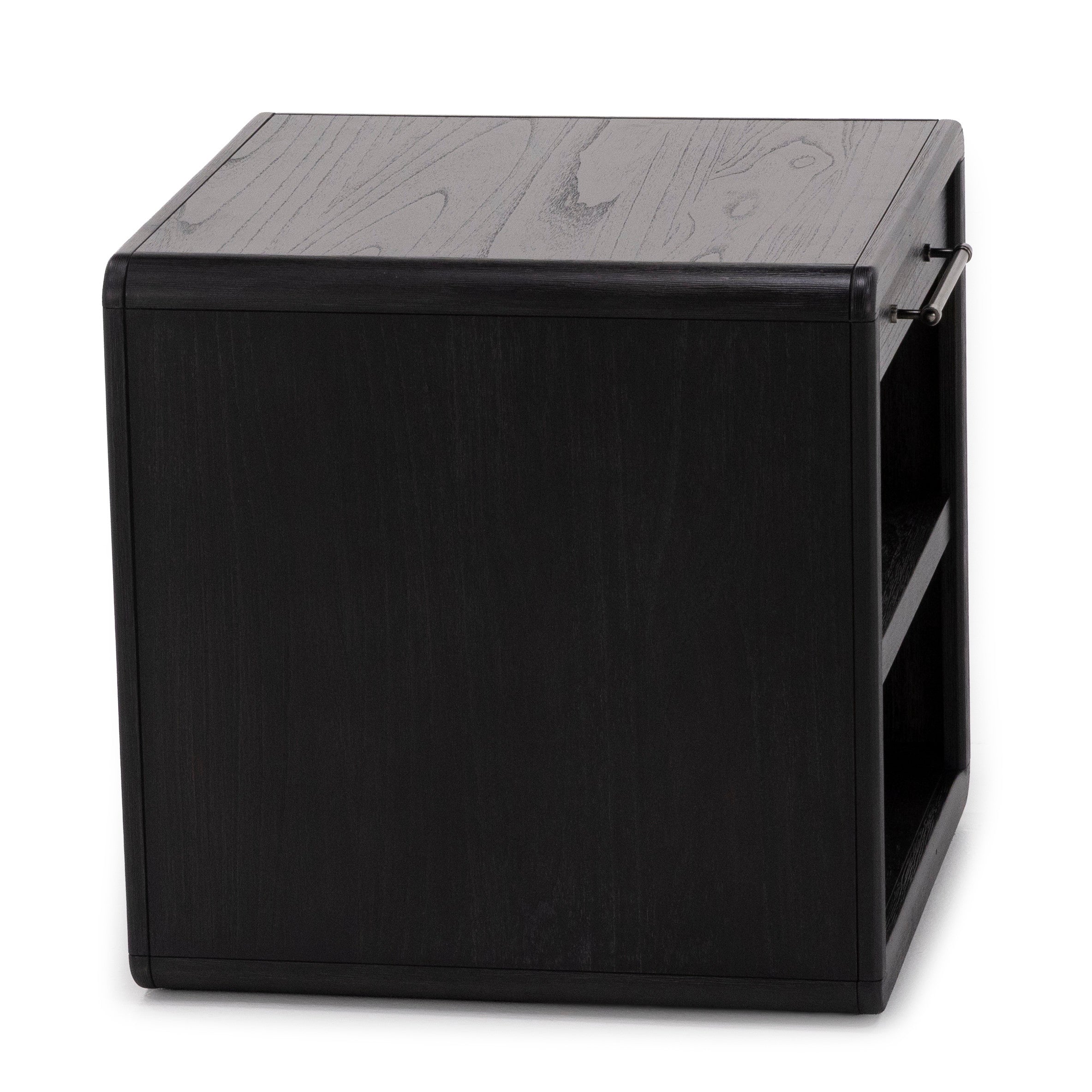 Black wood cube side table with handle and open shelf on one side.