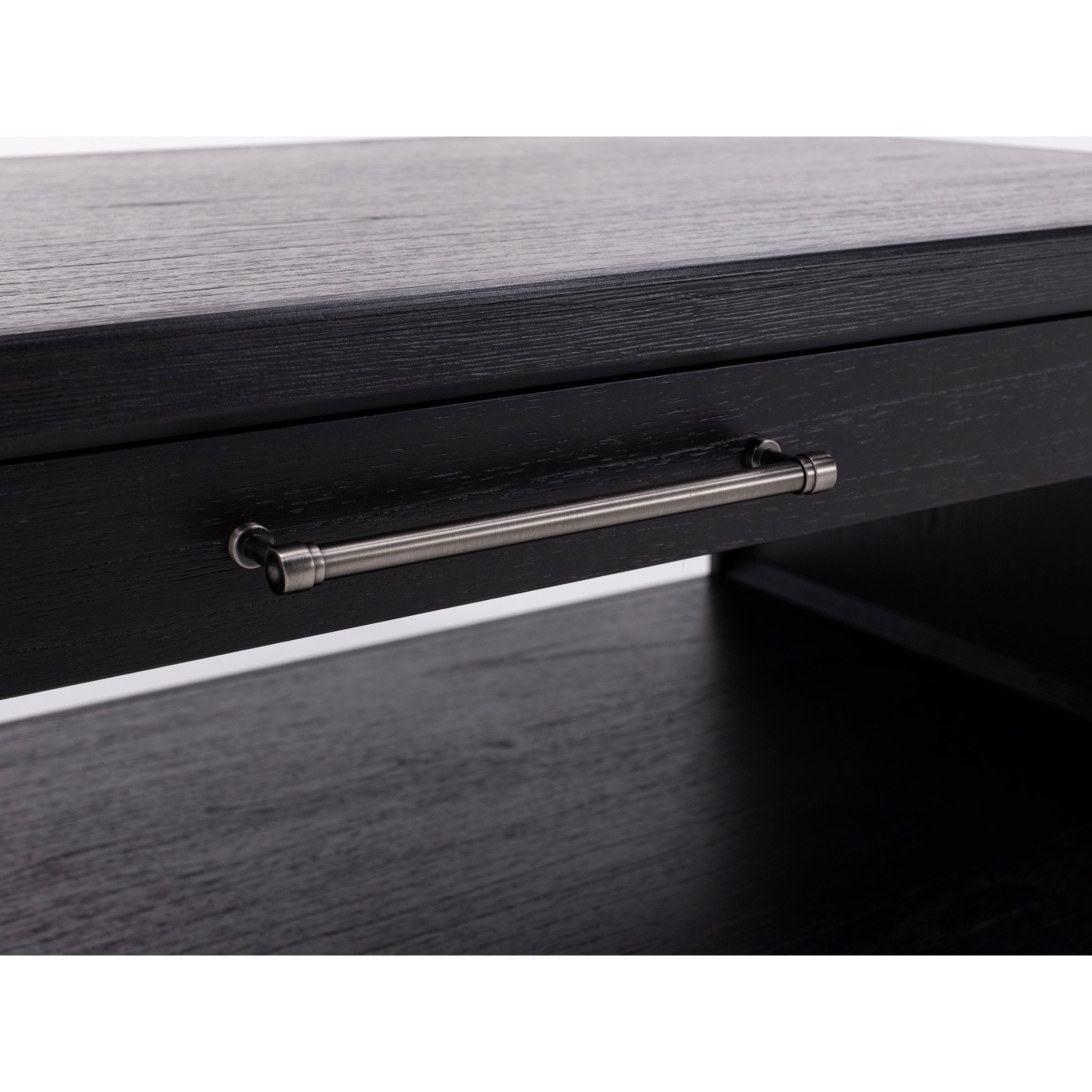 Close-up of a black wooden drawer with a metal handle.
