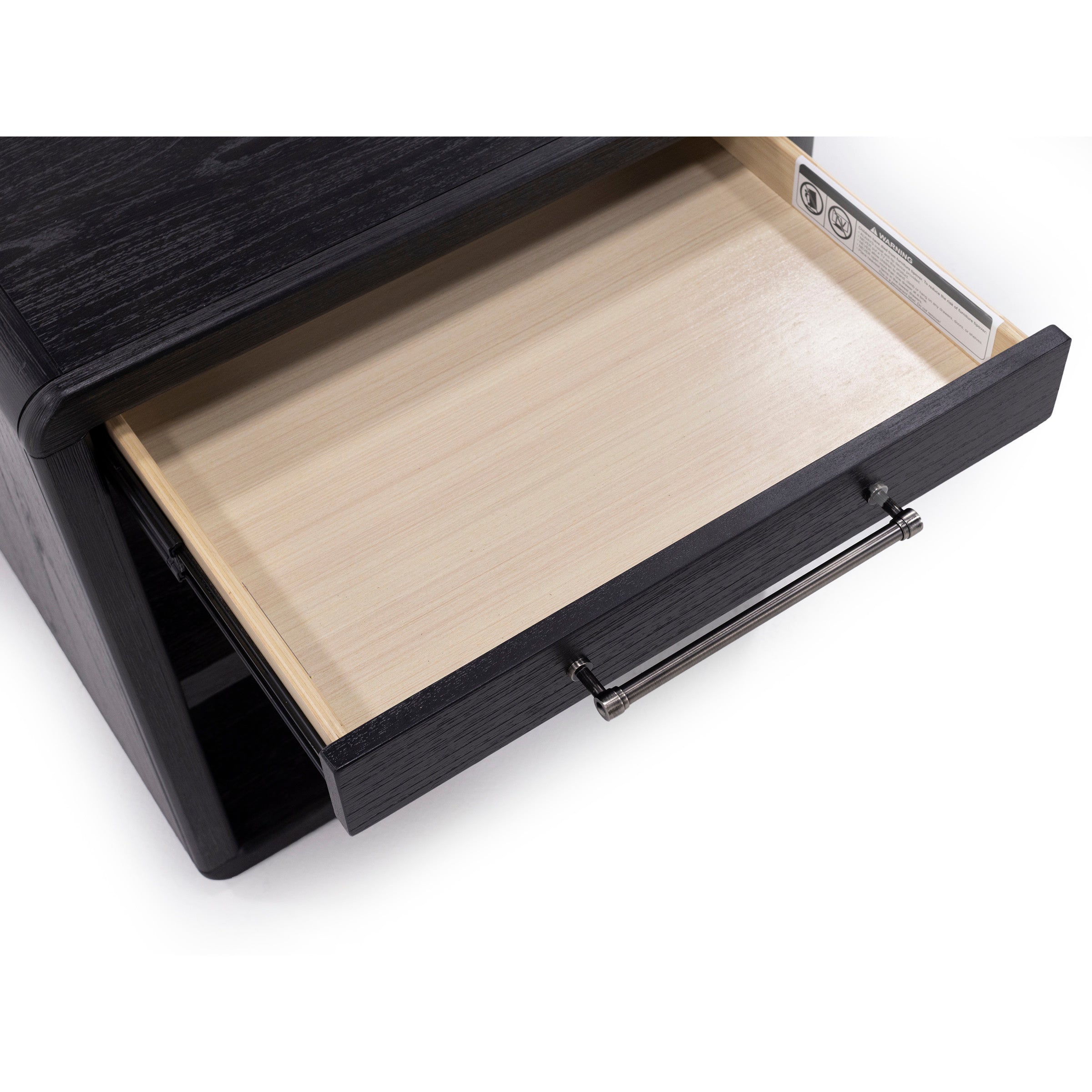 Open drawer in a black wood nightstand, showing empty light-colored interior.