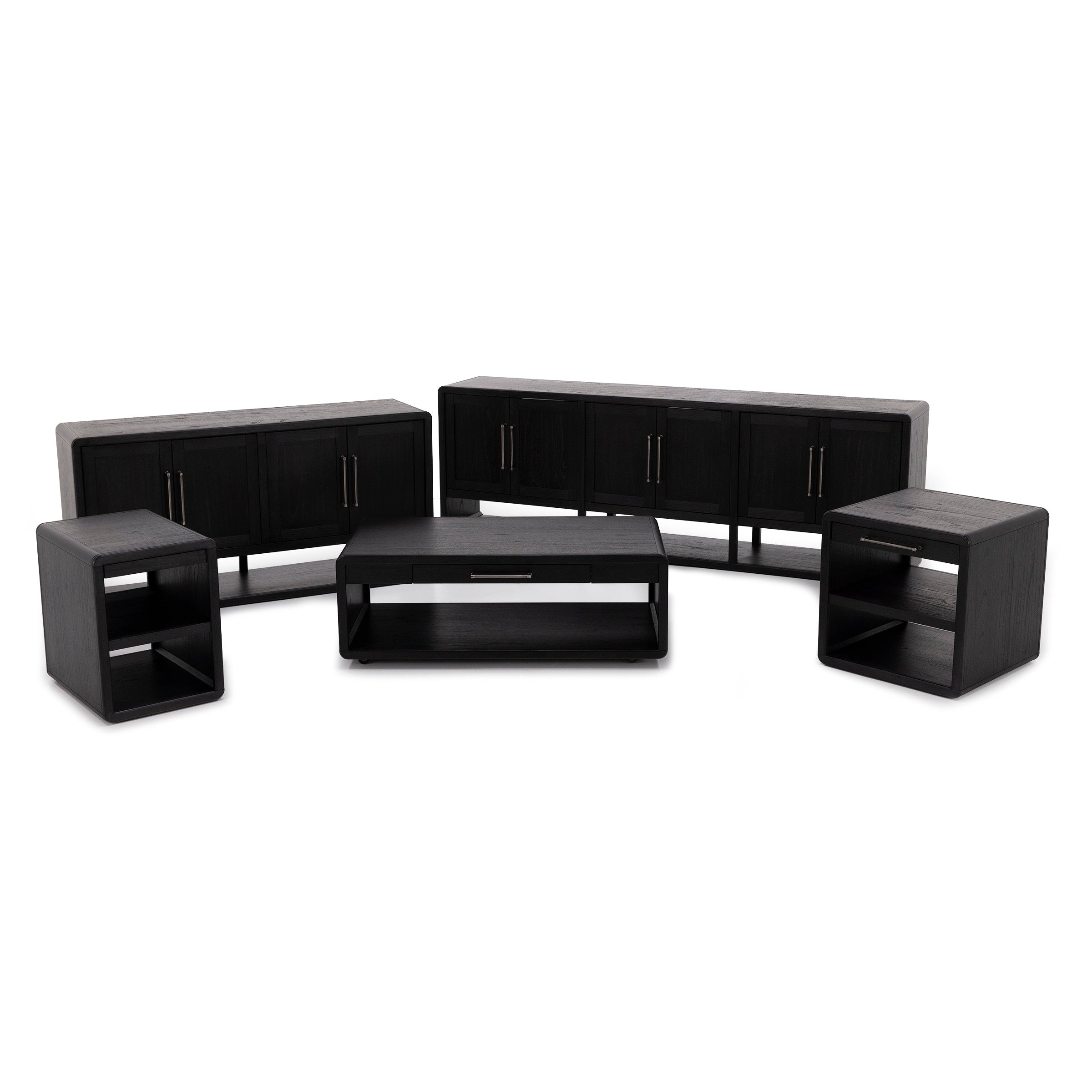Set of modern black wood tables and cabinets with sleek metal handles.