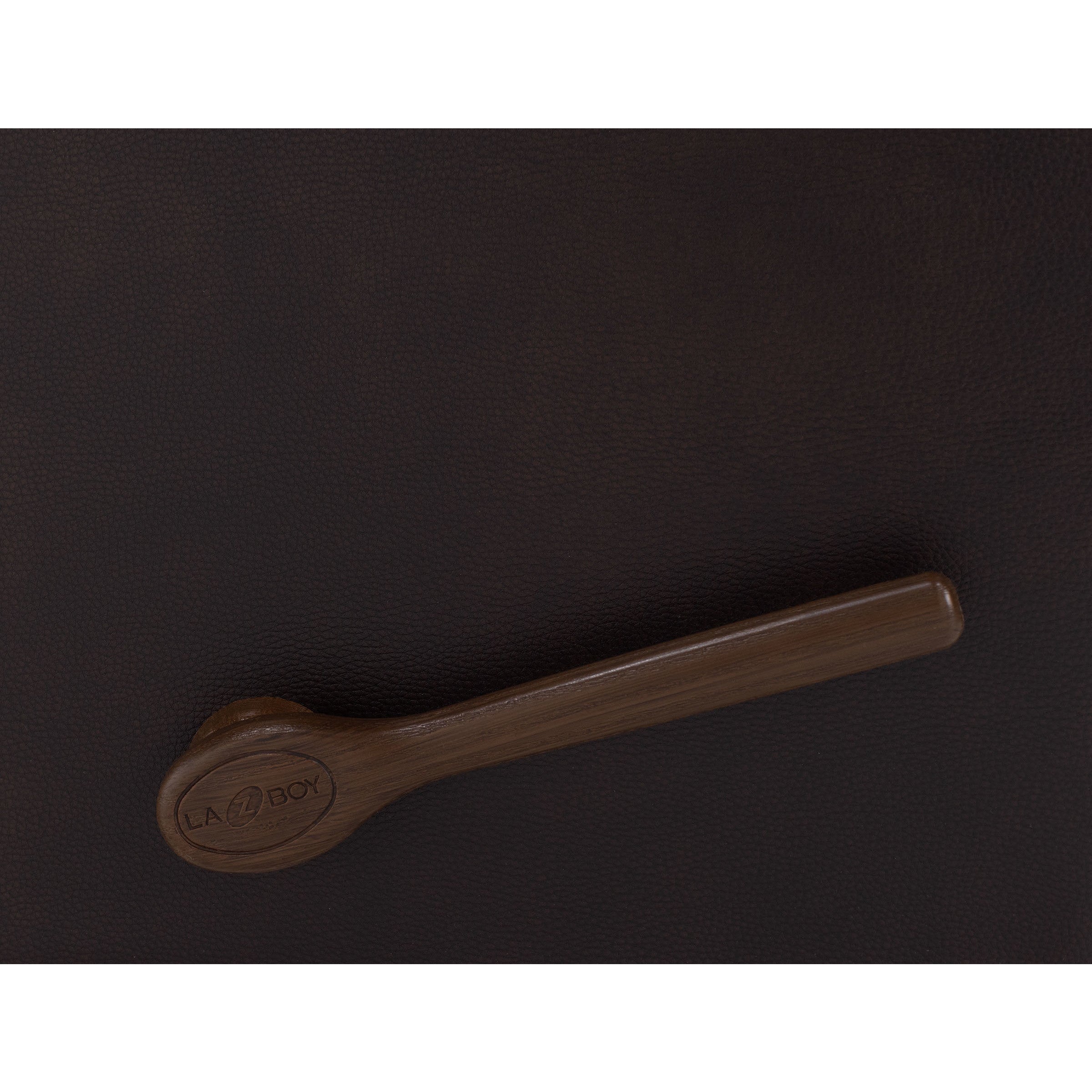 Brown recliner handle with La-Z-Boy logo against dark upholstery.