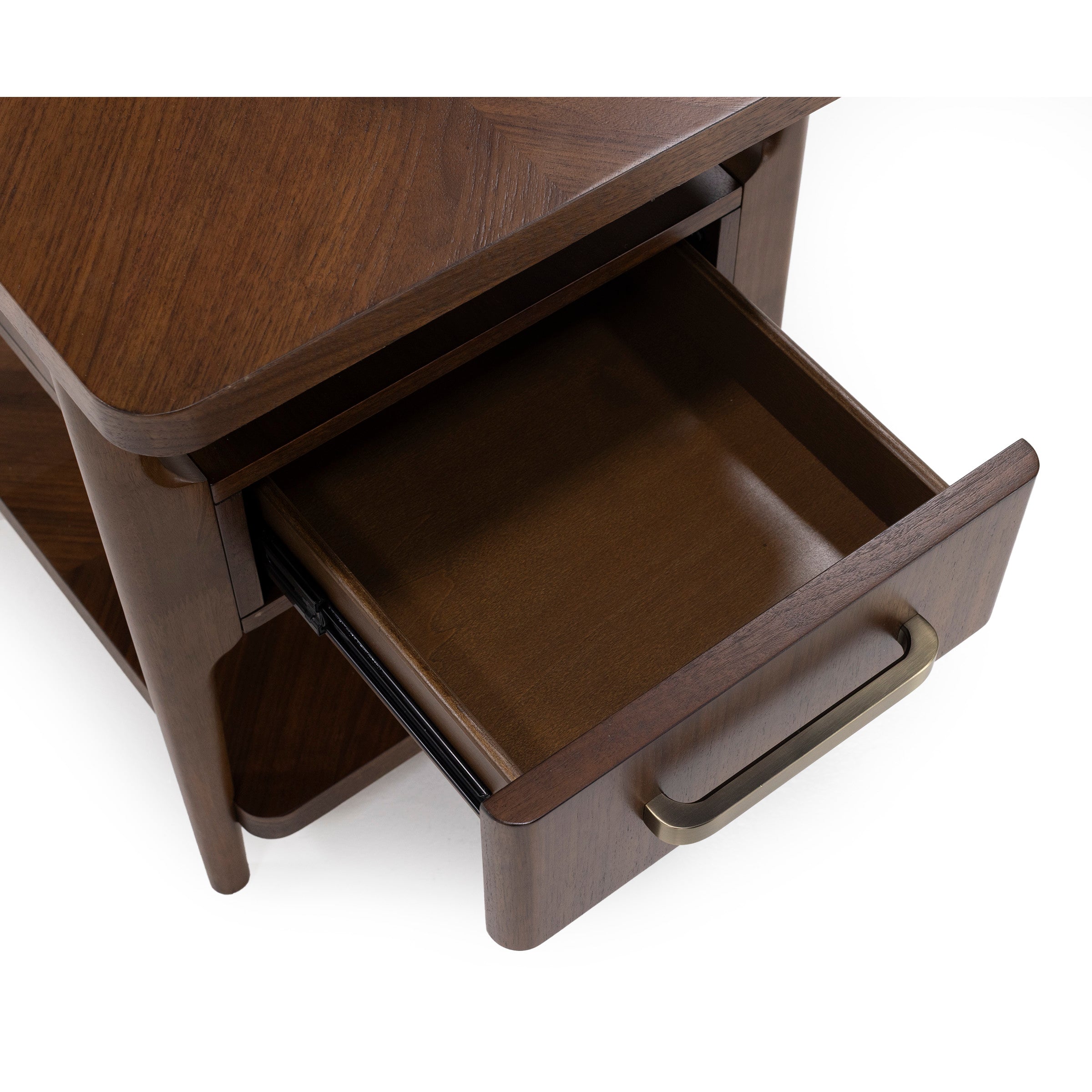Open wooden drawer with brass handle on a nightstand.