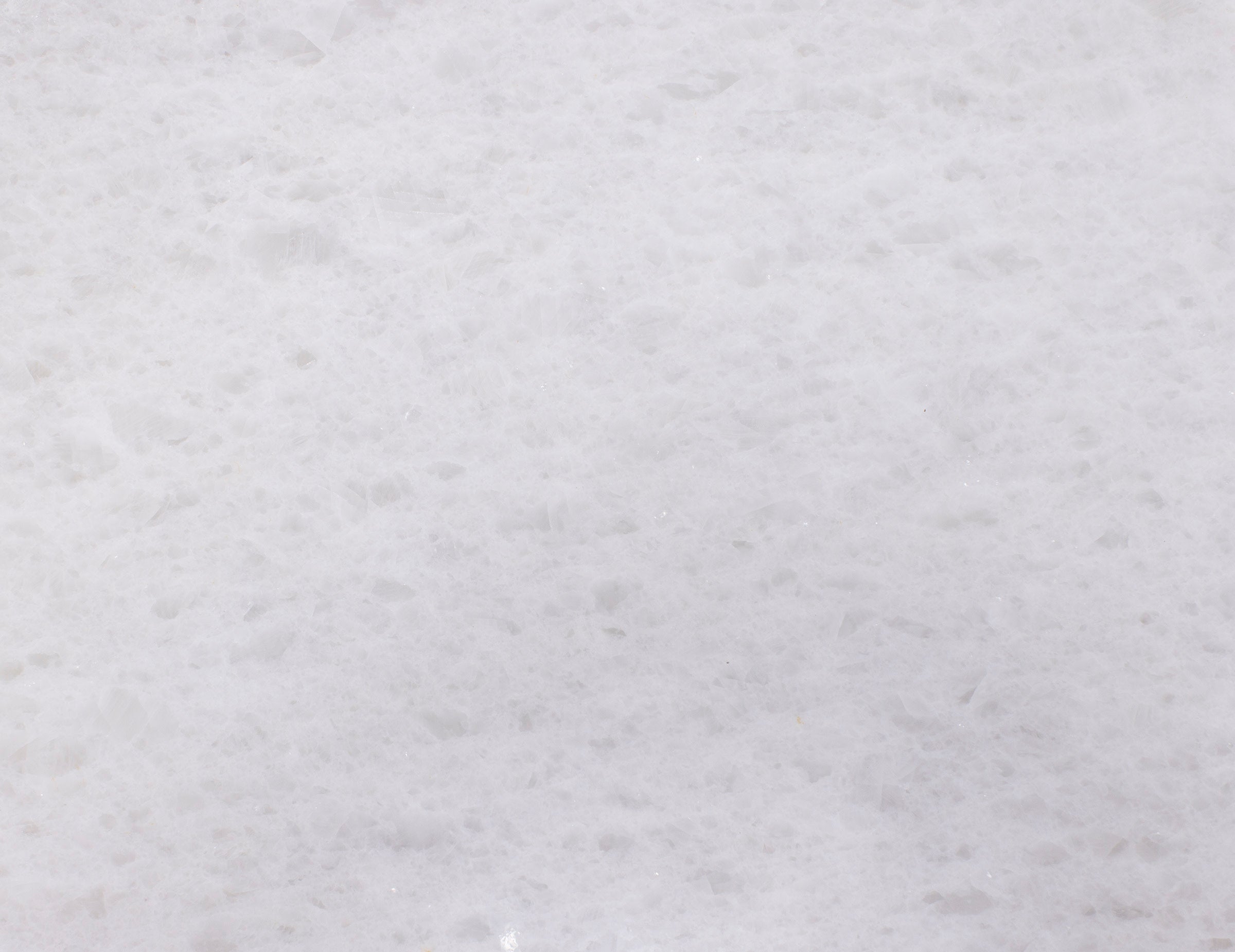 Close-up of a white quartz stone surface texture.
